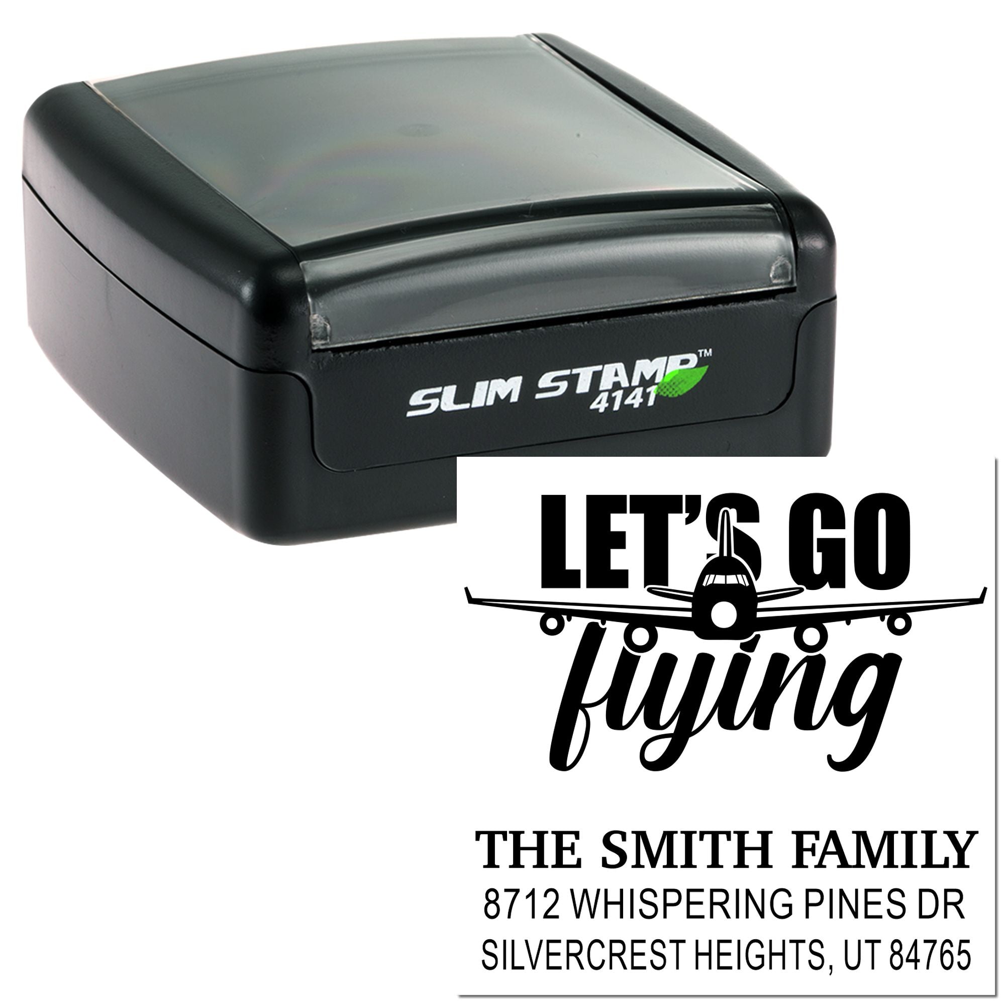 Slim self-inking stamp with custom Lets Go Flying return address imprint and airplane graphic on a white background.