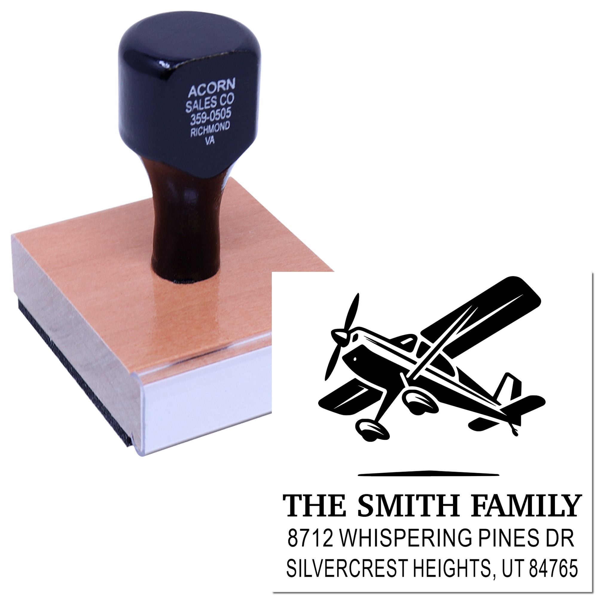 Self-inking custom family address stamp with airplane graphic and The Smith Family imprint on a white background.