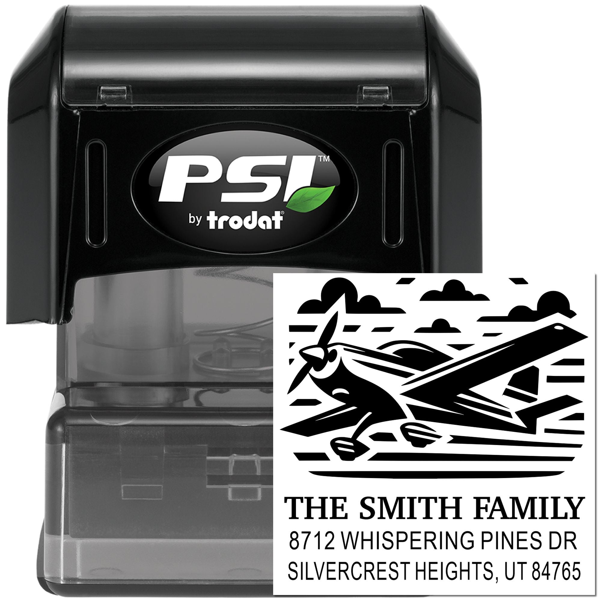 PSI by Trodat self-inking custom address stamp with airplane design, showing The Smith Family name and home address on a white background.
