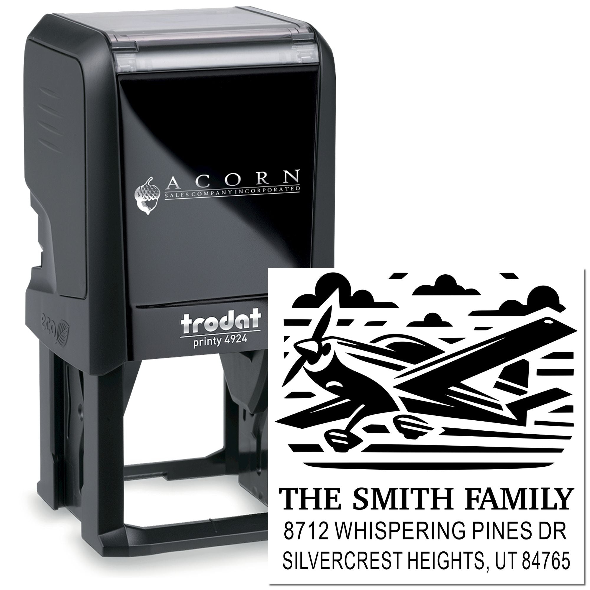Custom self-inking Trodat stamp with mountain scene and The Smith Family return address, shown on a black stamp tool against a white background.
