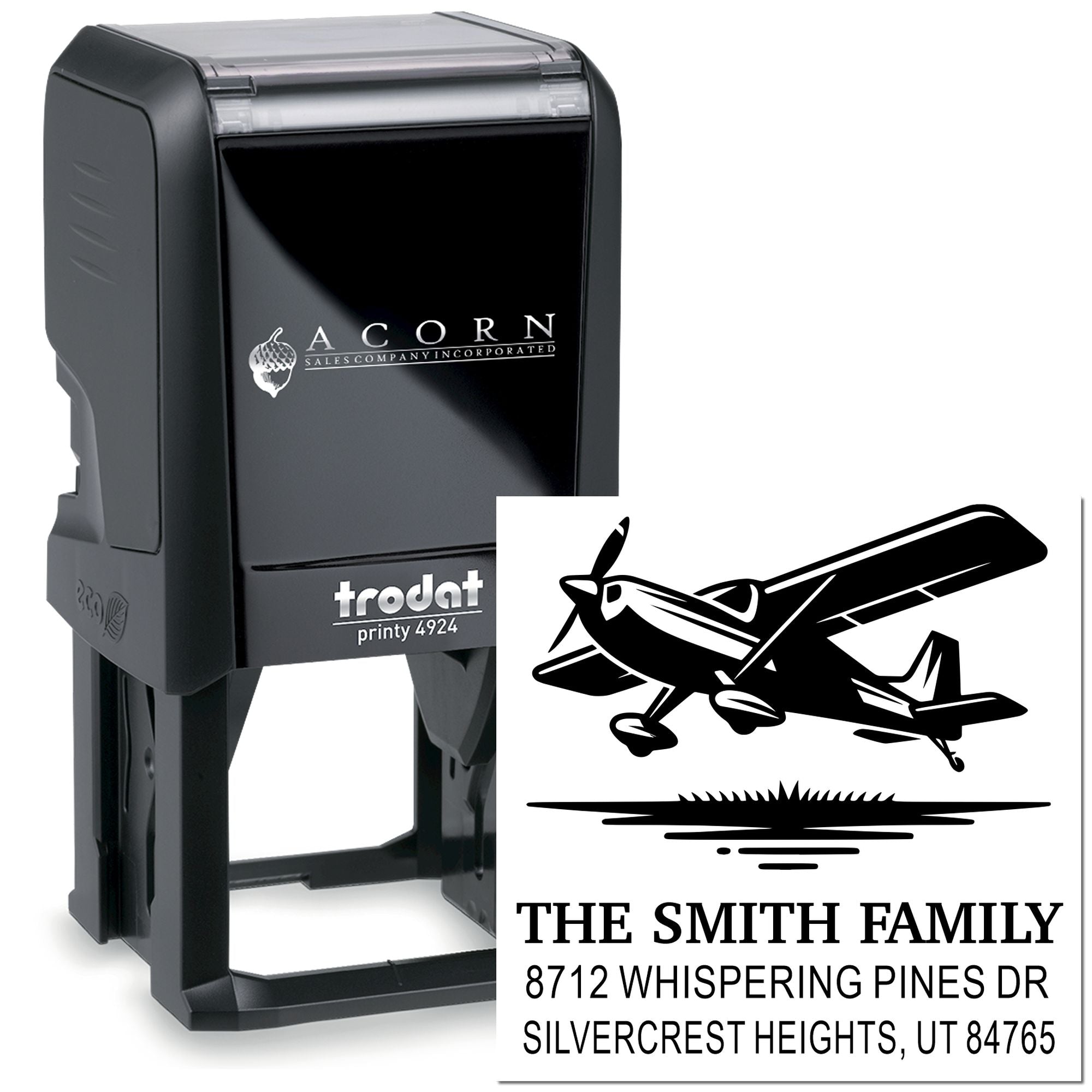 Custom self-inking Trodat Printy stamp with airplane graphic and The Smith Family return address on a white background.