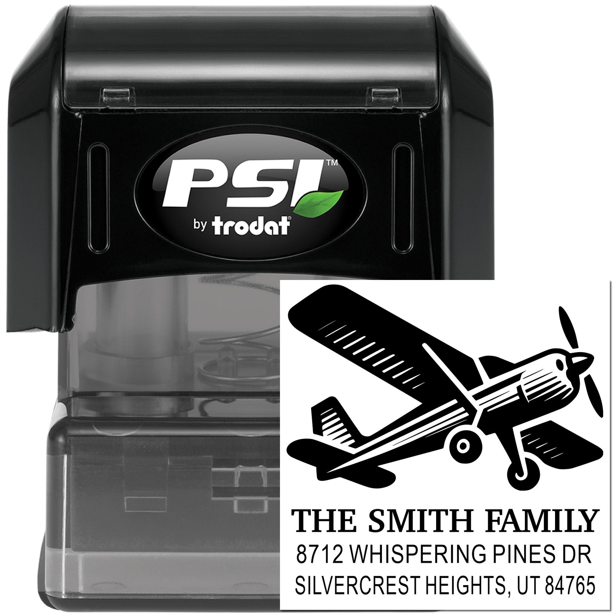 PSI by Trodat self-inking custom address stamp with airplane design and The Smith Family address imprint on a black stamp case.