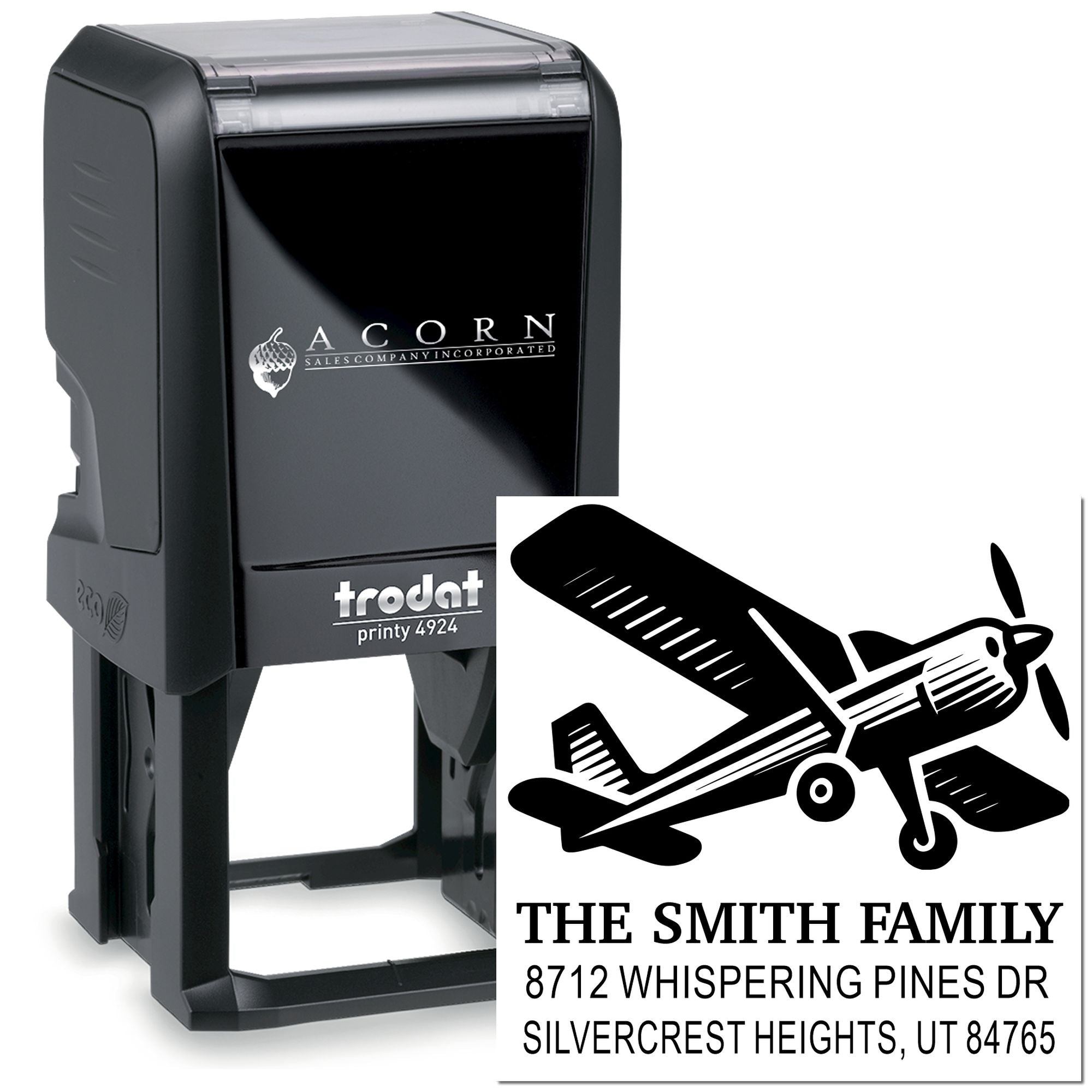 Custom self-inking address stamp with airplane graphic, showing The Smith Family and Silvercrest Heights, UT on a black Trodat stamp.
