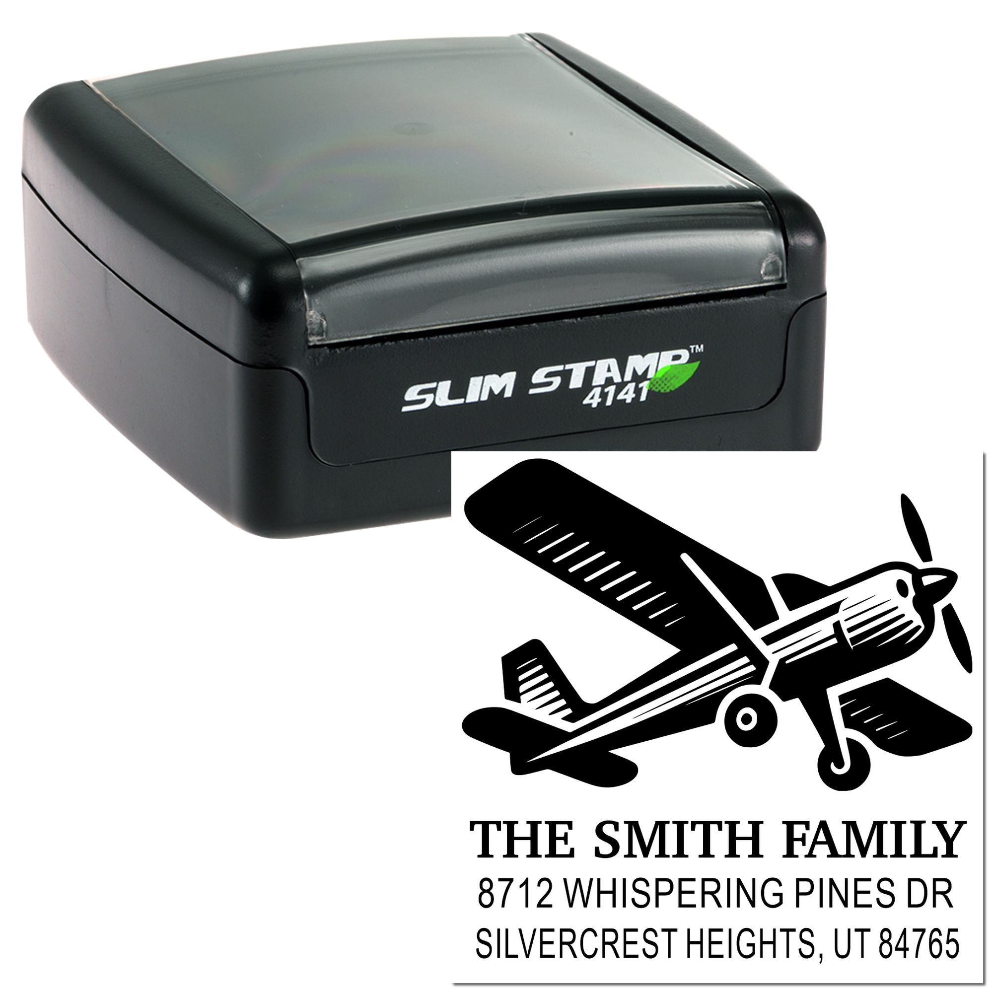 Slim Stamp 4141 self-inking stamp with airplane graphic and personalized family address imprint on a white background.