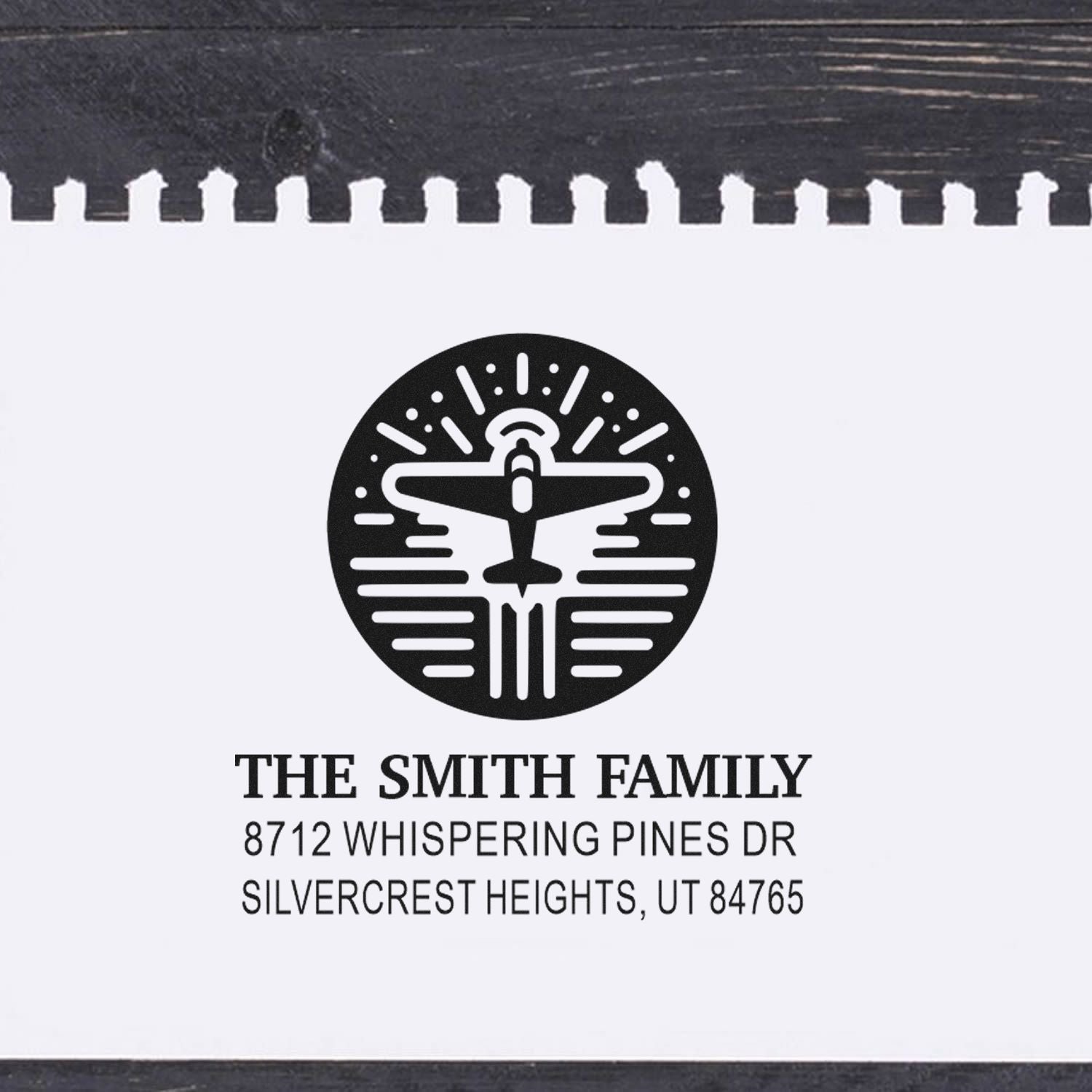 Personalized address stamp for The Smith Family with airplane logo and Silvercrest Heights, UT address on a white background.