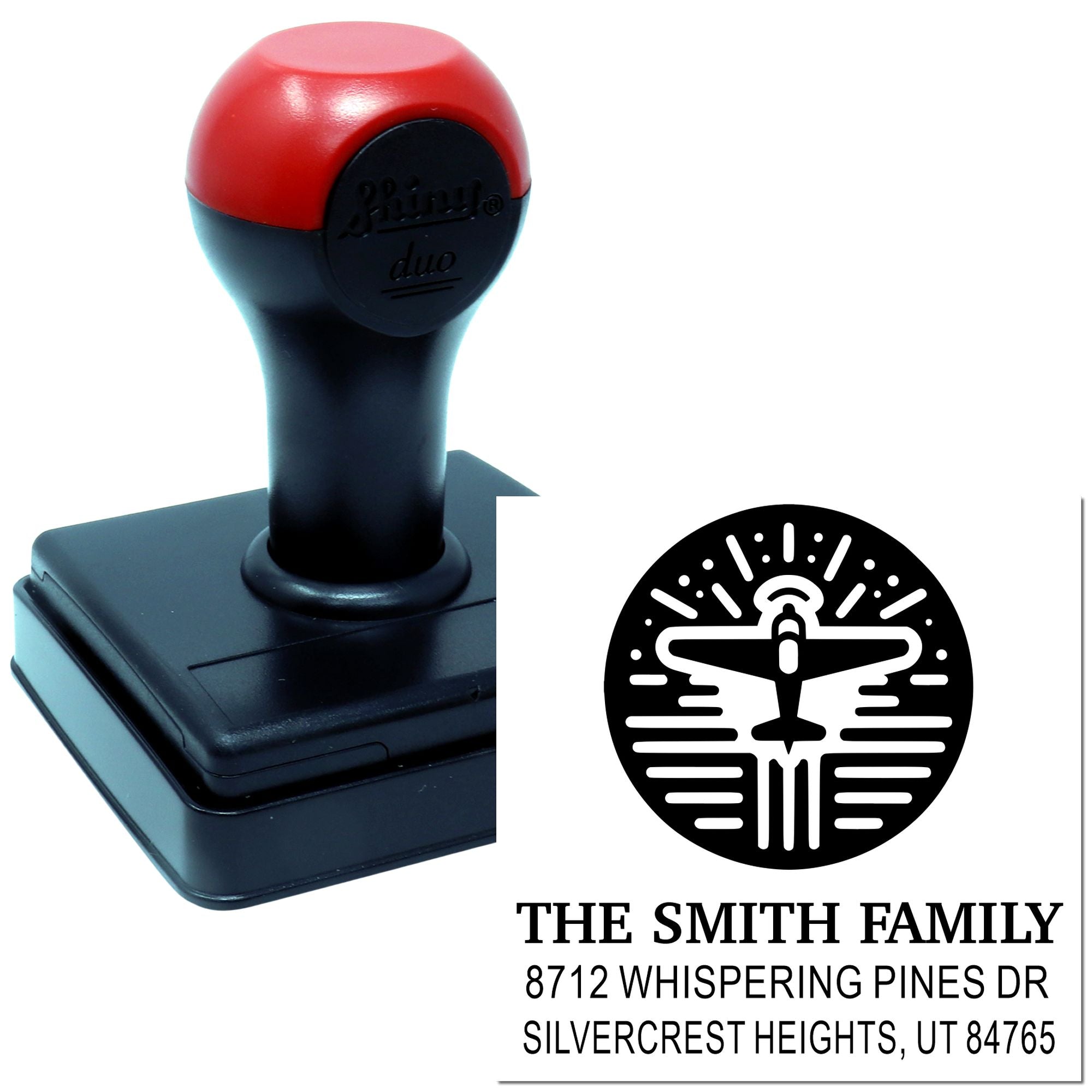Custom self-inking address stamp with airplane logo, red-and-black handle, and imprint for The Smith Family in Silvercrest Heights, UT.