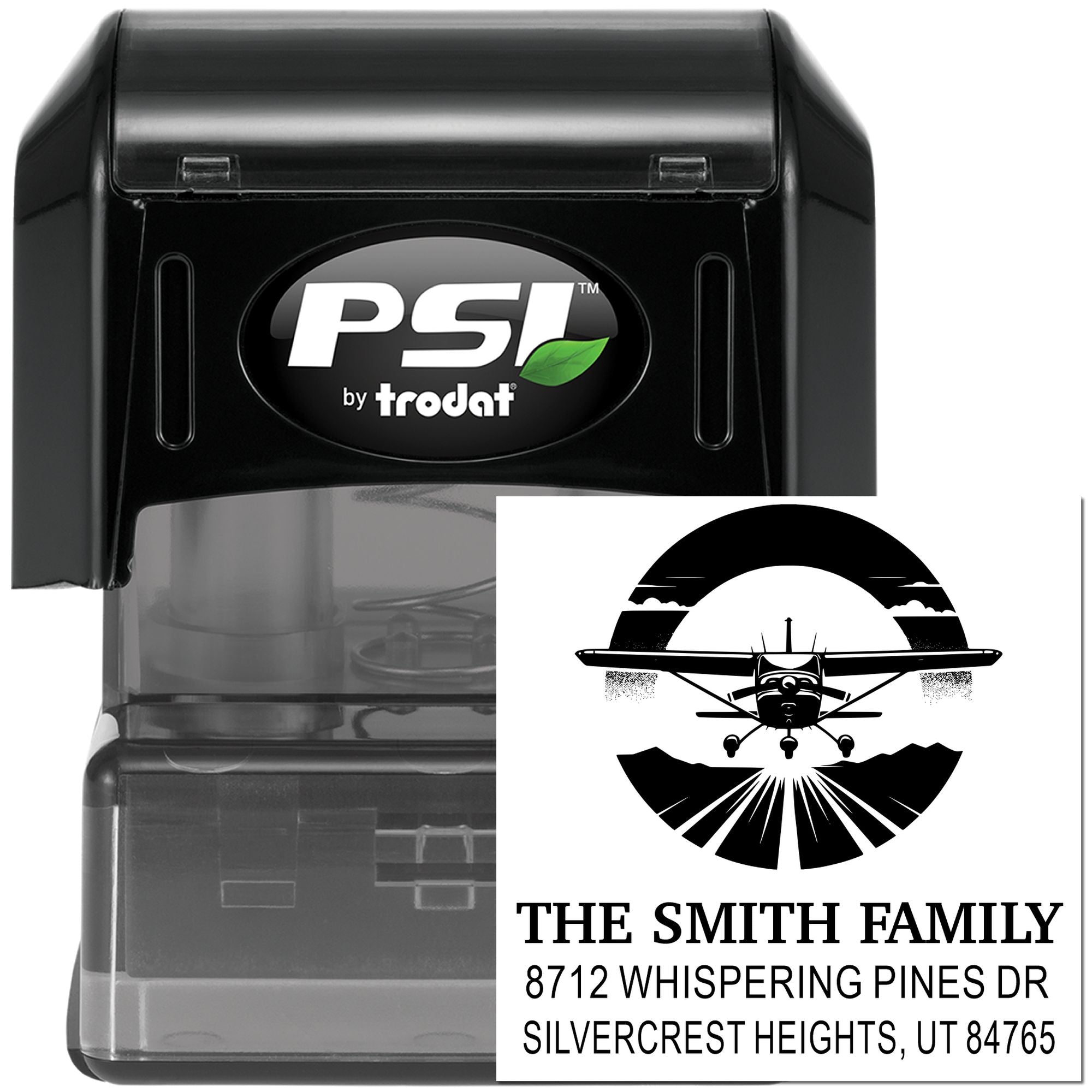 Self-inking PSI by Trodat custom address stamp with airplane design and The Smith Family return address on black stamp case.