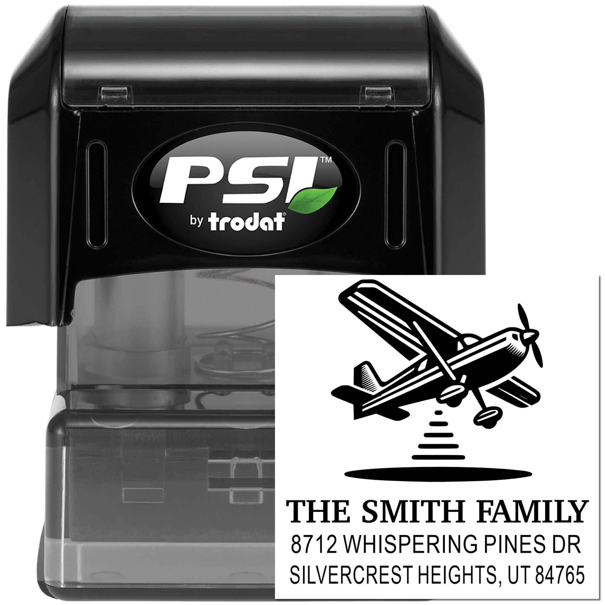 PSI by Trodat personalized return address stamp with airplane design, black self-inking case, and custom family name on white background.