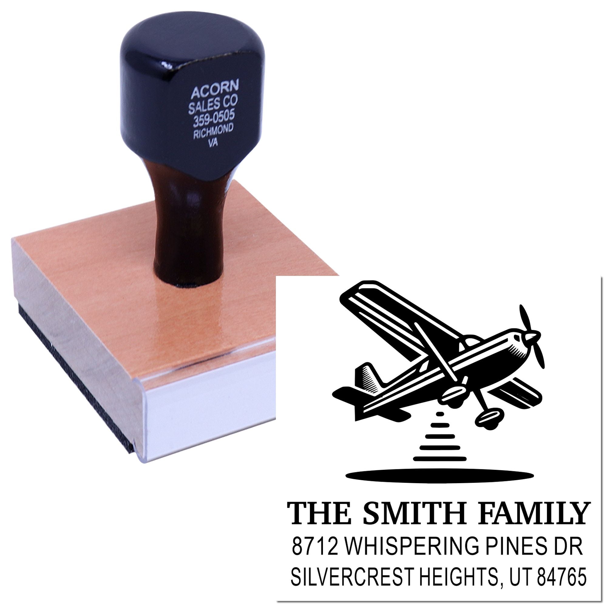 Custom self-inking address stamp with airplane logo, showing The Smith Family return address imprint on a white background.
