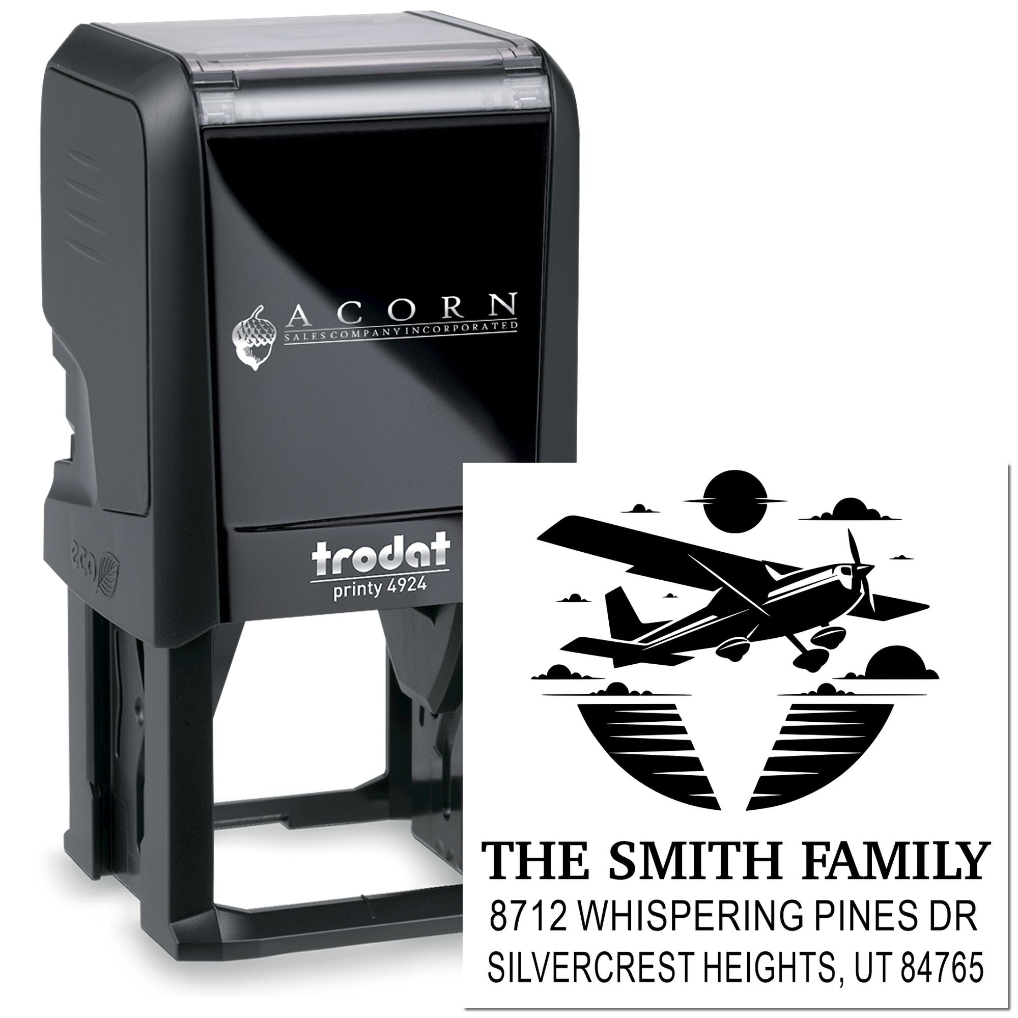 Custom self-inking address stamp with airplane logo, featuring The Smith Family name and home address on a Trodat Printy stamp.
