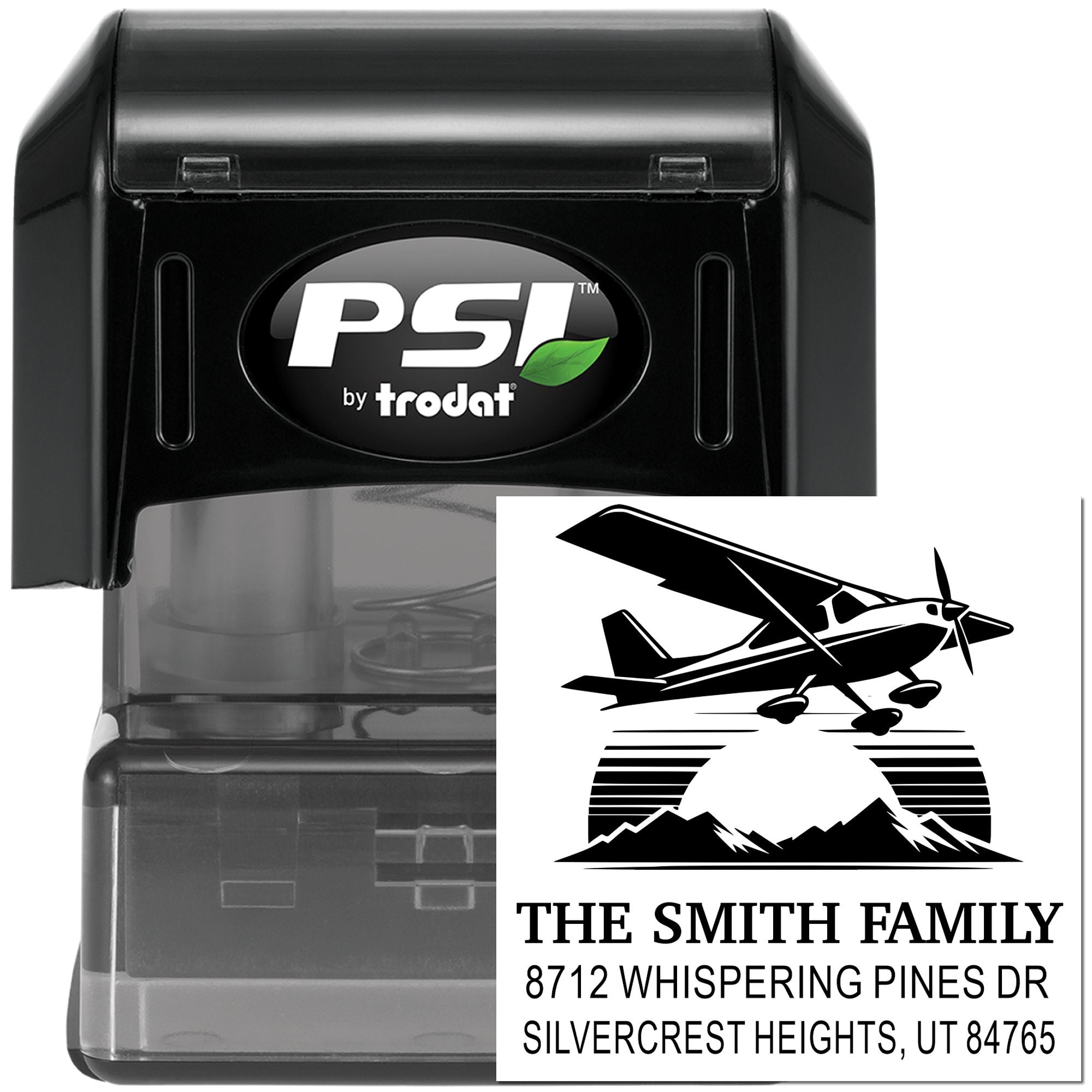 PSI by Trodat self-inking stamp with custom return address design for The Smith Family, featuring a small airplane, mountains, and address text.