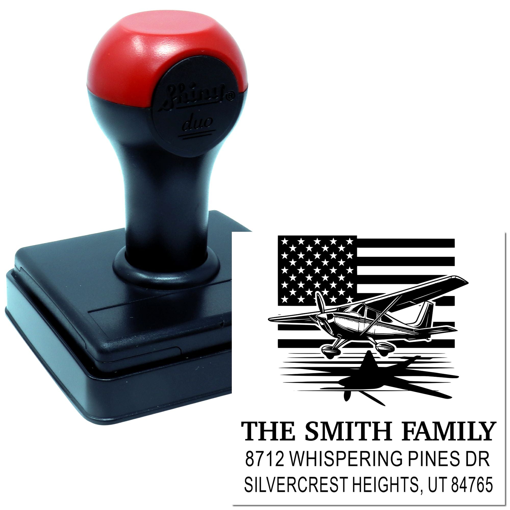 Custom self-inking address stamp with American flag and airplane design, shown on a black and red stamp base with Smith family address imprint.