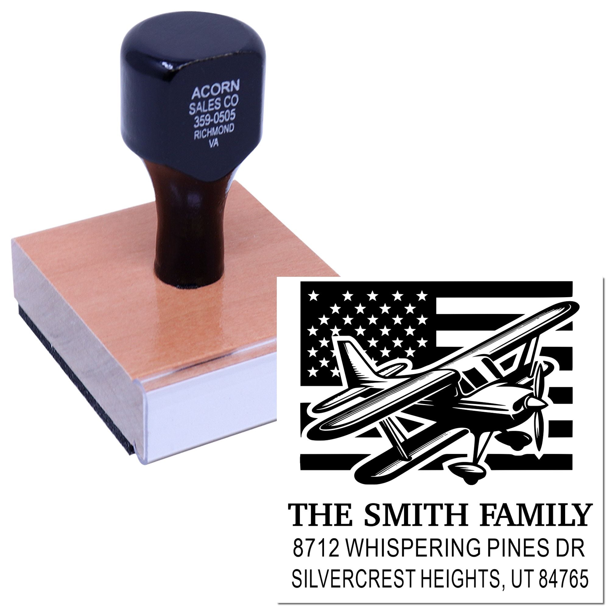 Personalized wooden rubber address stamp with airplane and U.S. flag design, shown on a stamp block with custom family address text.