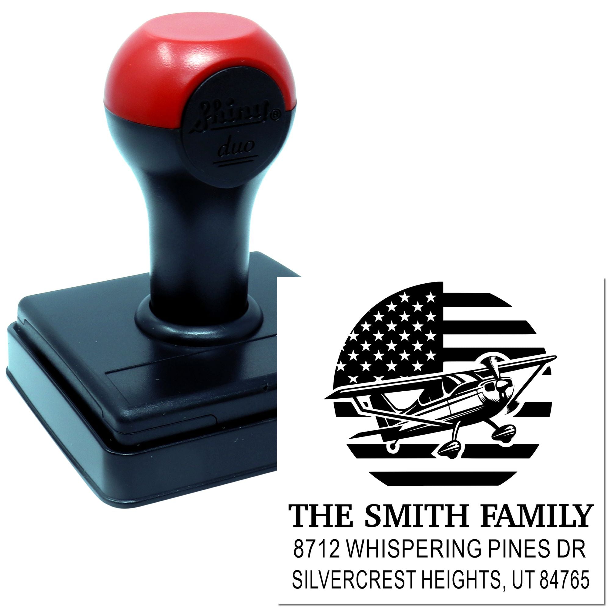 Custom self-inking address stamp with airplane American flag design and Smith family return address on a white background.