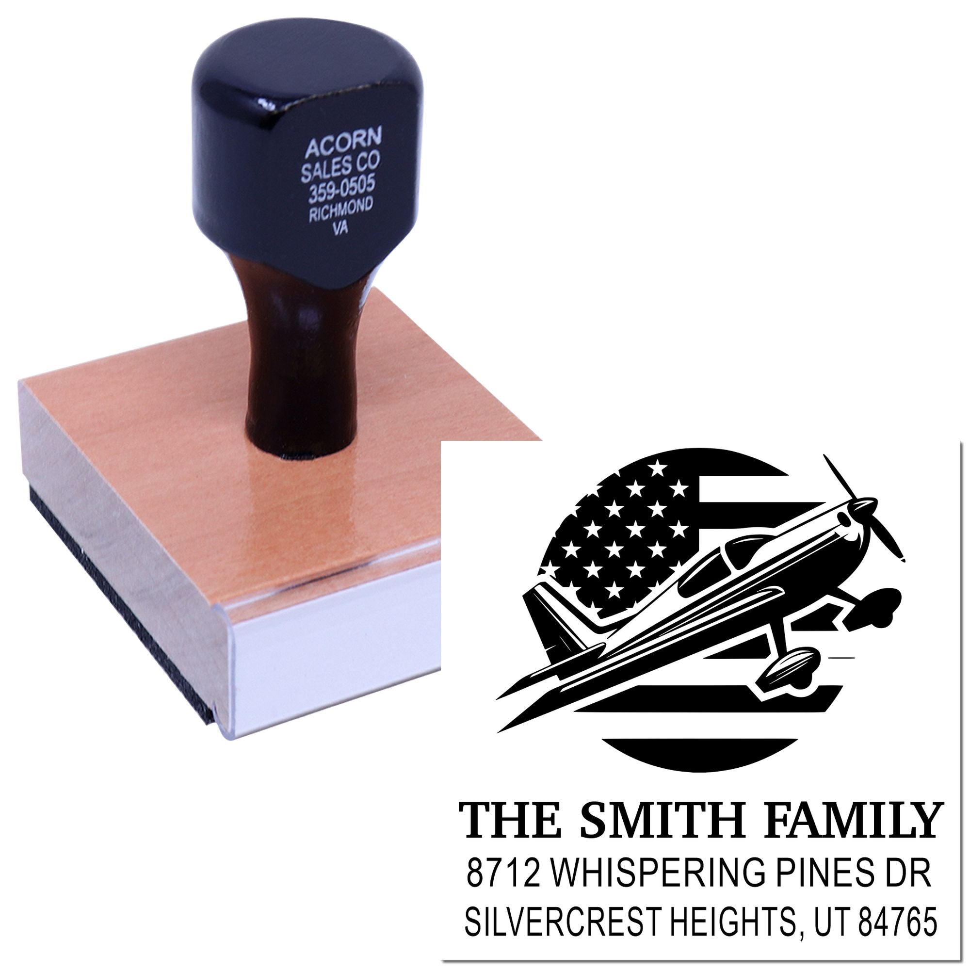 Custom rubber address stamp with airplane and U.S. flag design, shown on a wooden block beside a stamped sample for The Smith Family mailing address.