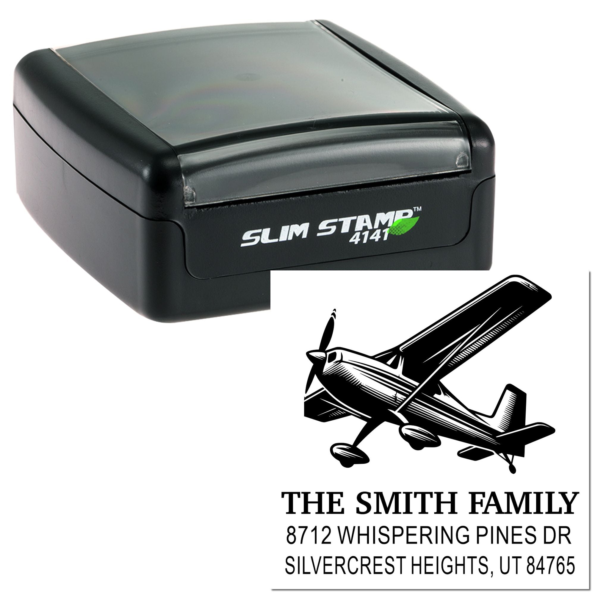 Slim Stamp 4141 self-inking address stamp with airplane graphic, custom family name, street address, and city, state ZIP on white background.
