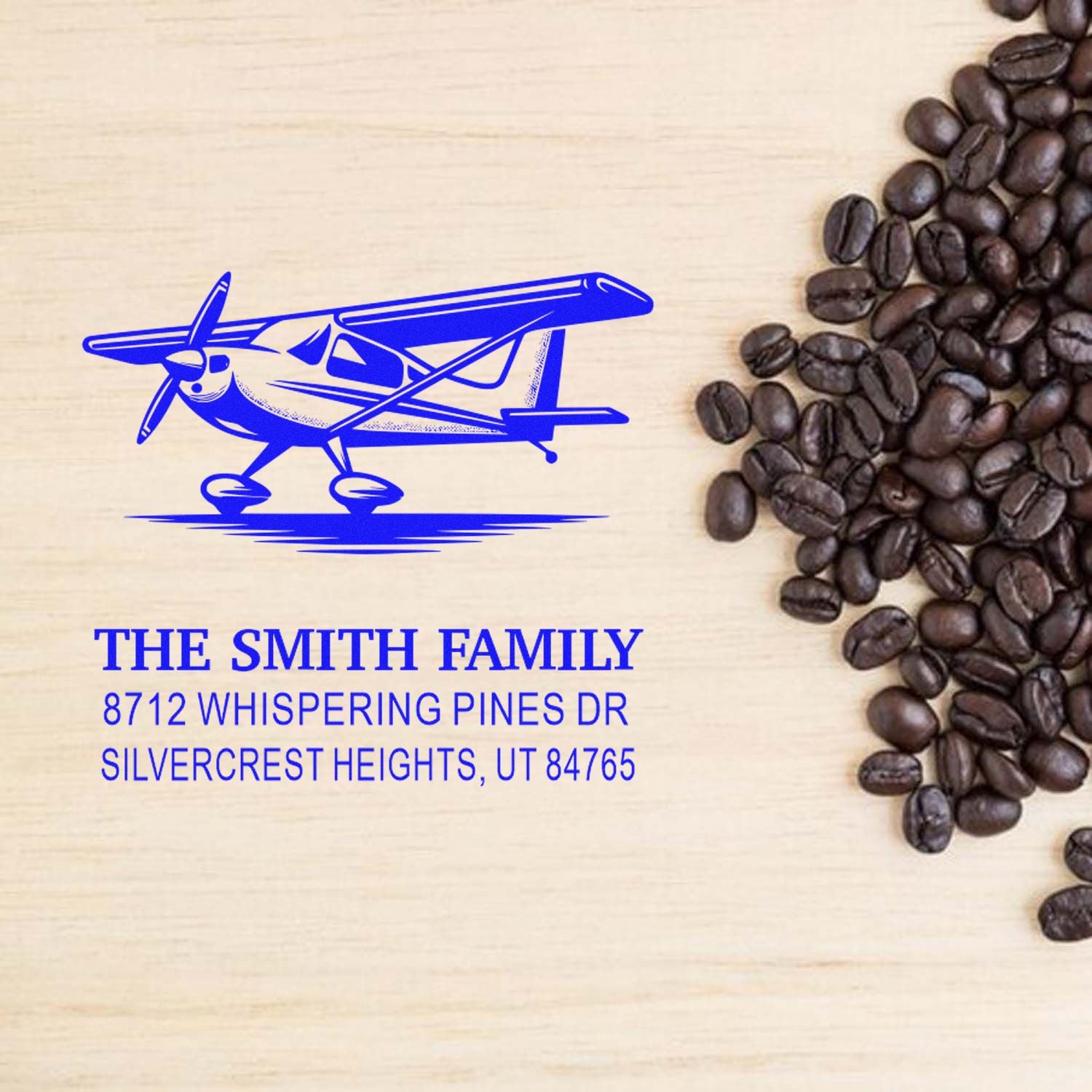 Custom airplane return address stamp with coffee beans on wood background, featuring The Smith Family in Silvercrest Heights, UT.