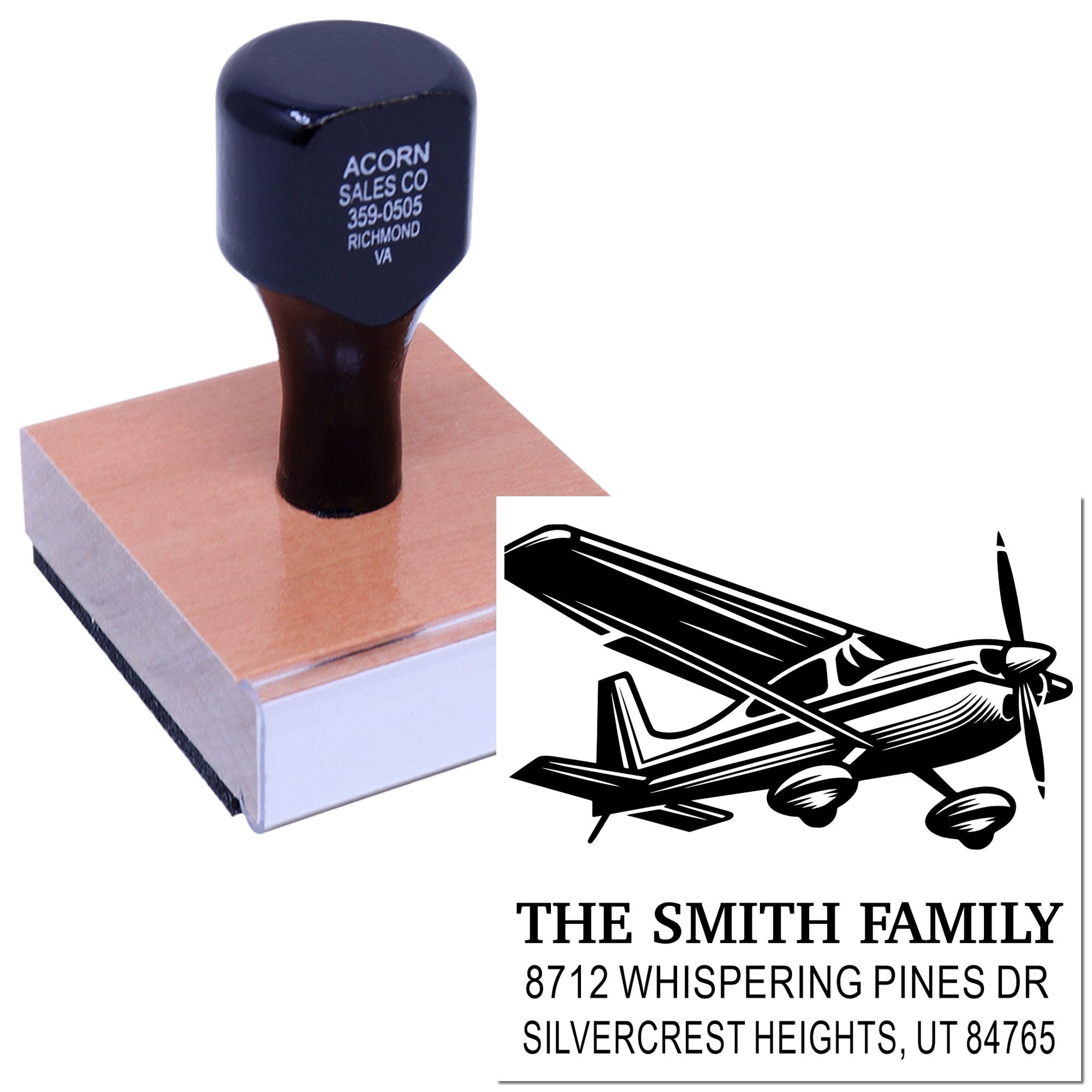 Personalized self-inking address stamp with airplane graphic, showing The Smith Family and Utah address on a white background.