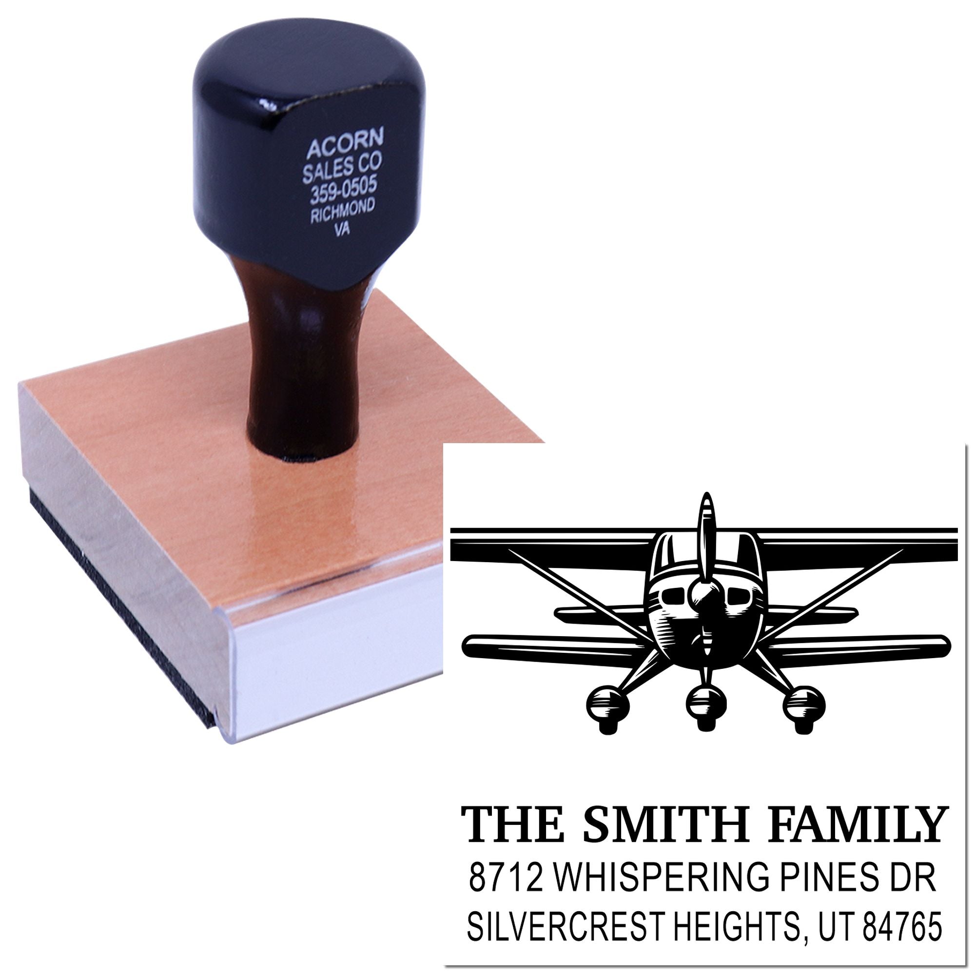 Custom wooden rubber stamp with airplane design and The Smith Family address imprint on a white background.