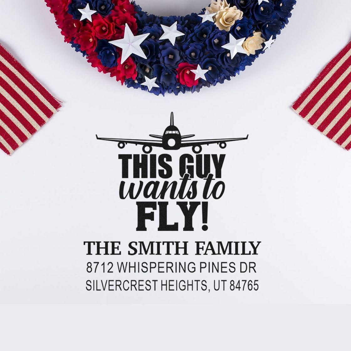 Custom airplane address stamp with This Guy Wants to Fly! text, Smith family name, and Utah address on white background with patriotic red, white and blue decor.