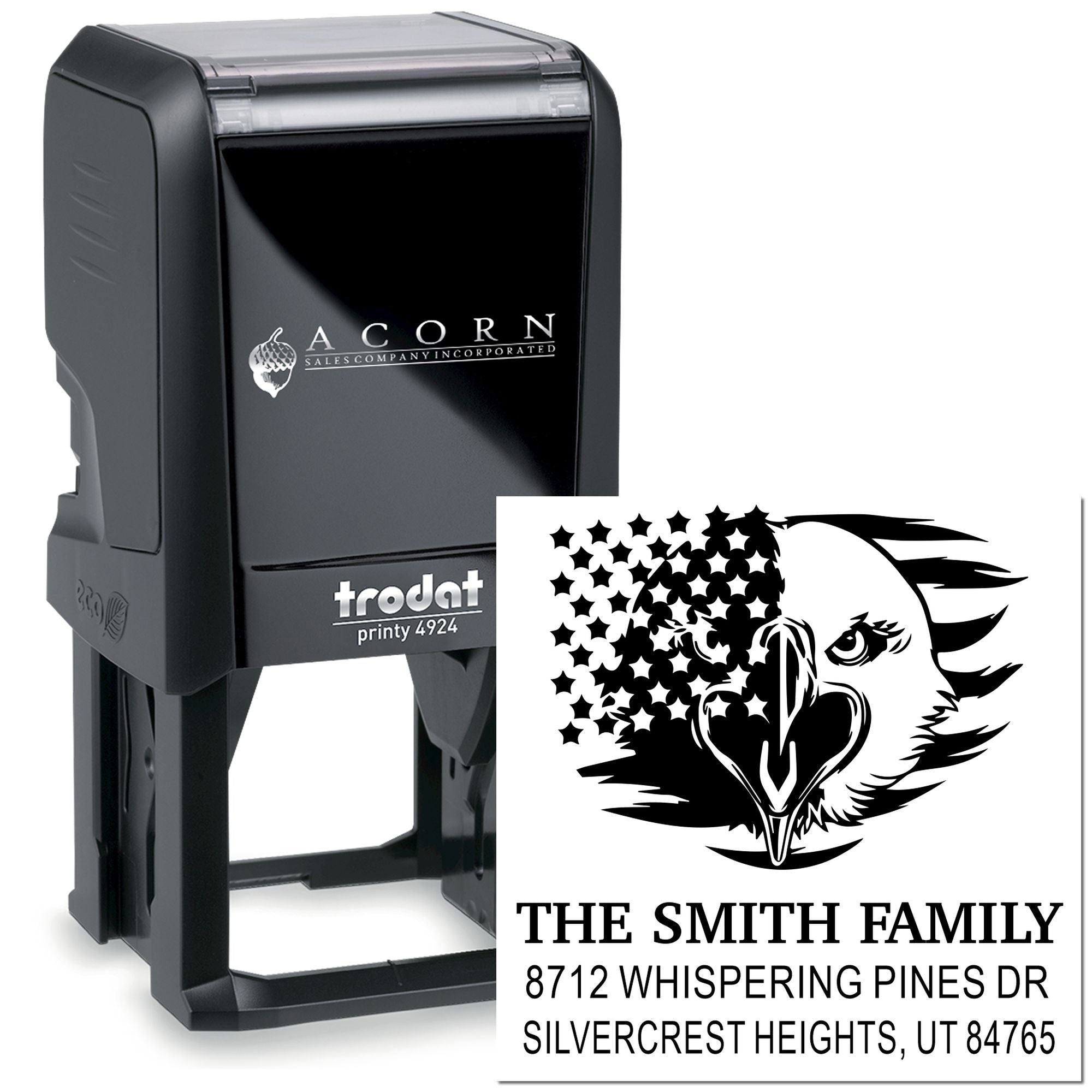 Trodat Printy 4924 custom self-inking address stamp with eagle-and-stars design, shown beside the stamped Smith Family address on a white background.
