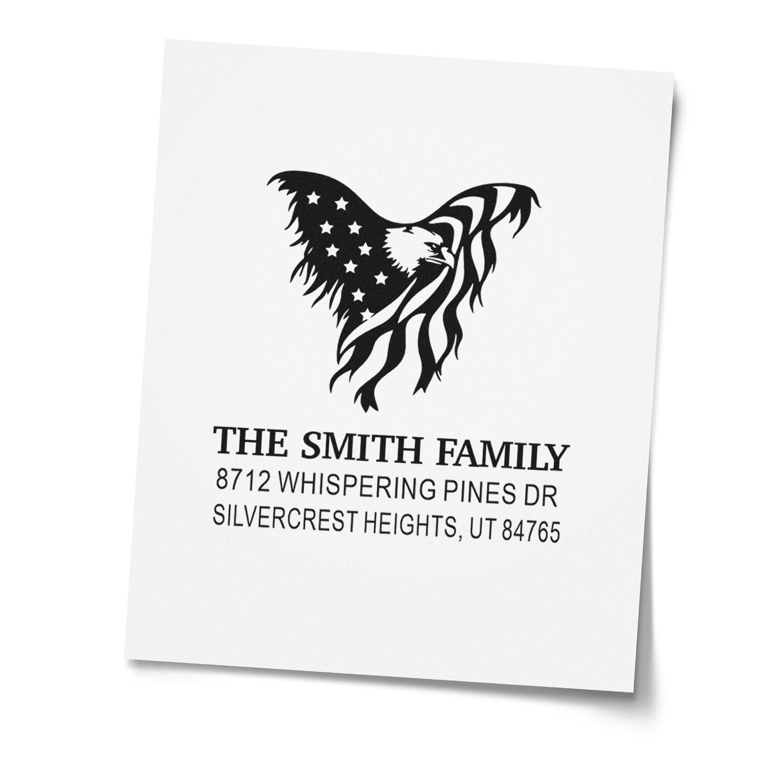Custom address stamp with American flag eagle design and The Smith Family return address on white paper.