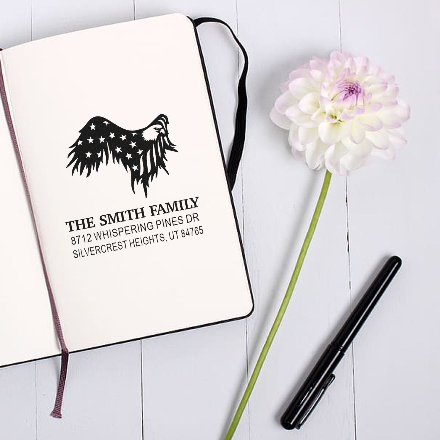 Custom self-inking rubber address stamp with eagle and stars design, personalized family name and mailing address for envelopes, cards, and stationery