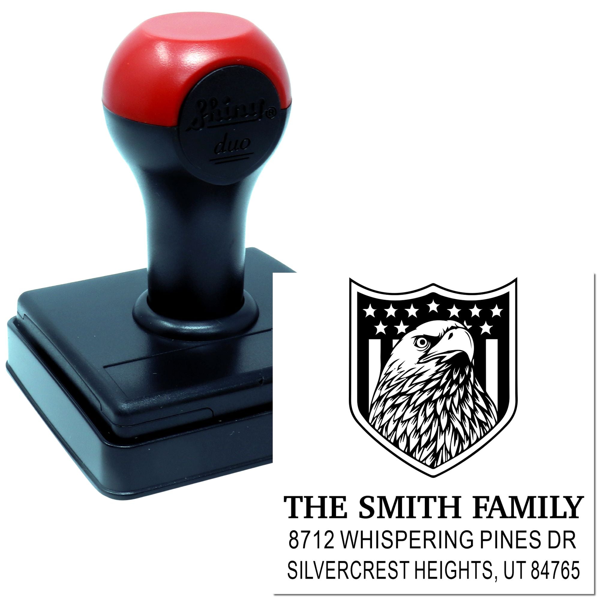 Custom self-inking rubber address stamp with eagle crest design, family name, and return address for mailing, branding, and personal correspondence.
