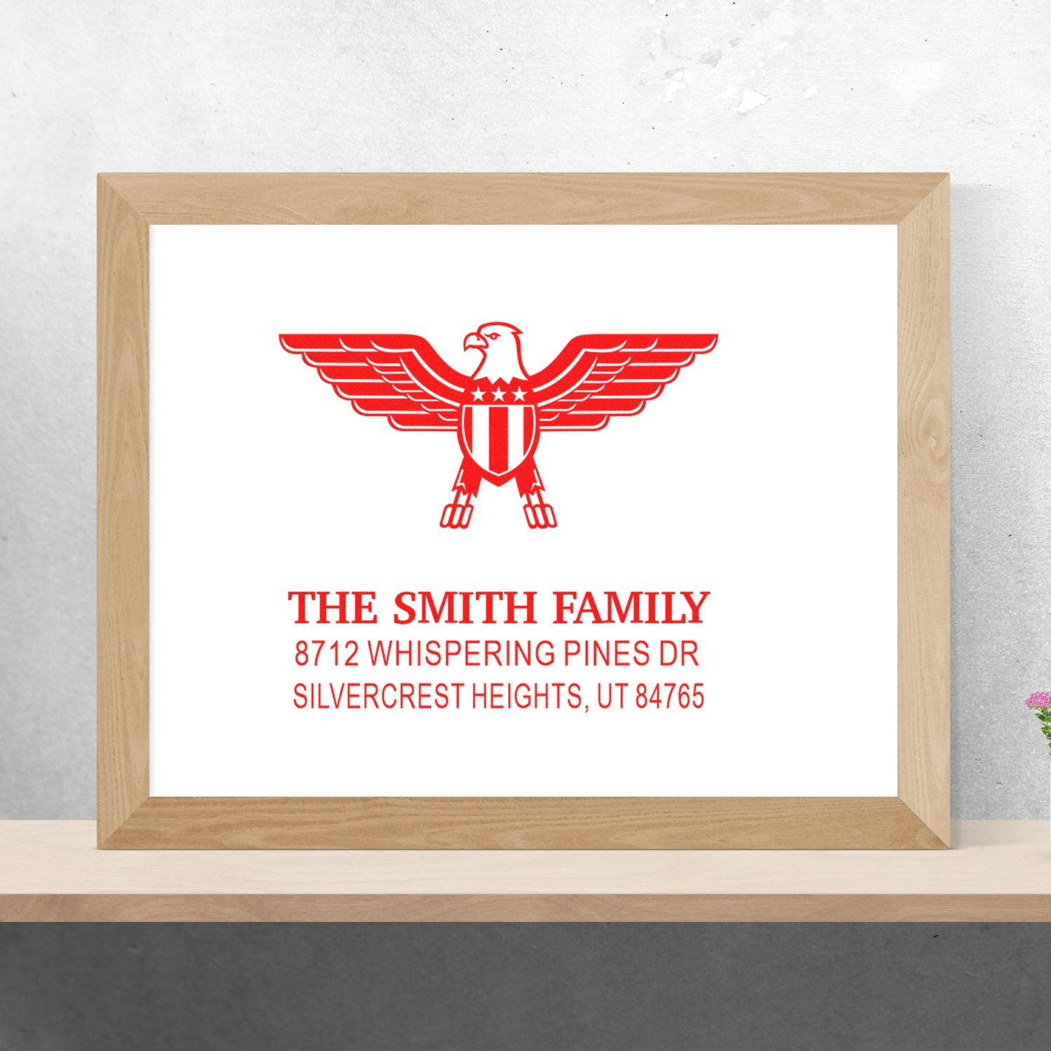 Custom rubber stamp with red eagle crest and return address for The Smith Family, 8712 Whispering Pines Dr, Silvercrest Heights, UT 84765