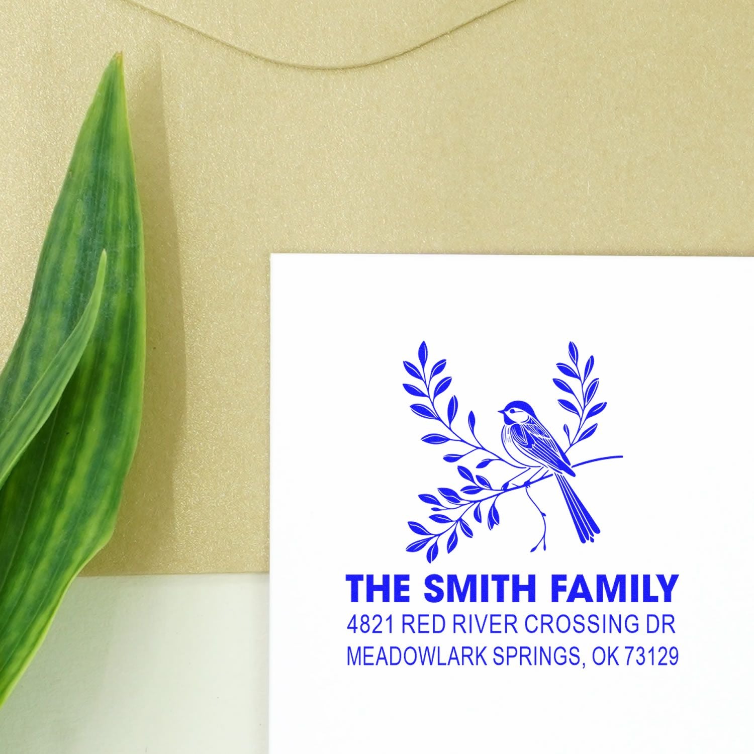 Custom return address rubber stamp with bird and leafy branch design, personalized for The Smith Family, Meadowlark Springs, OK 73129