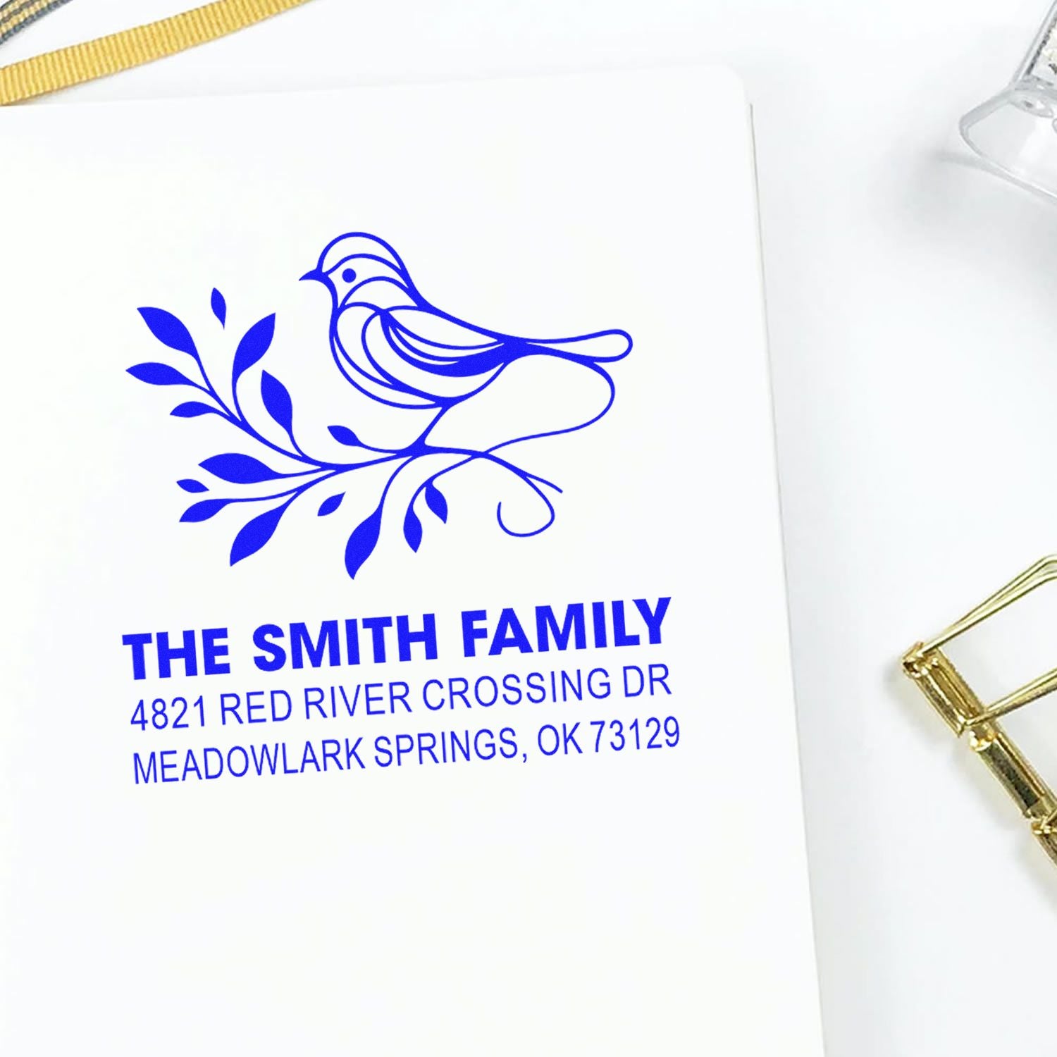 Custom return address rubber stamp with bird and floral design, featuring The Smith Family name and Meadowlark Springs, OK mailing address.