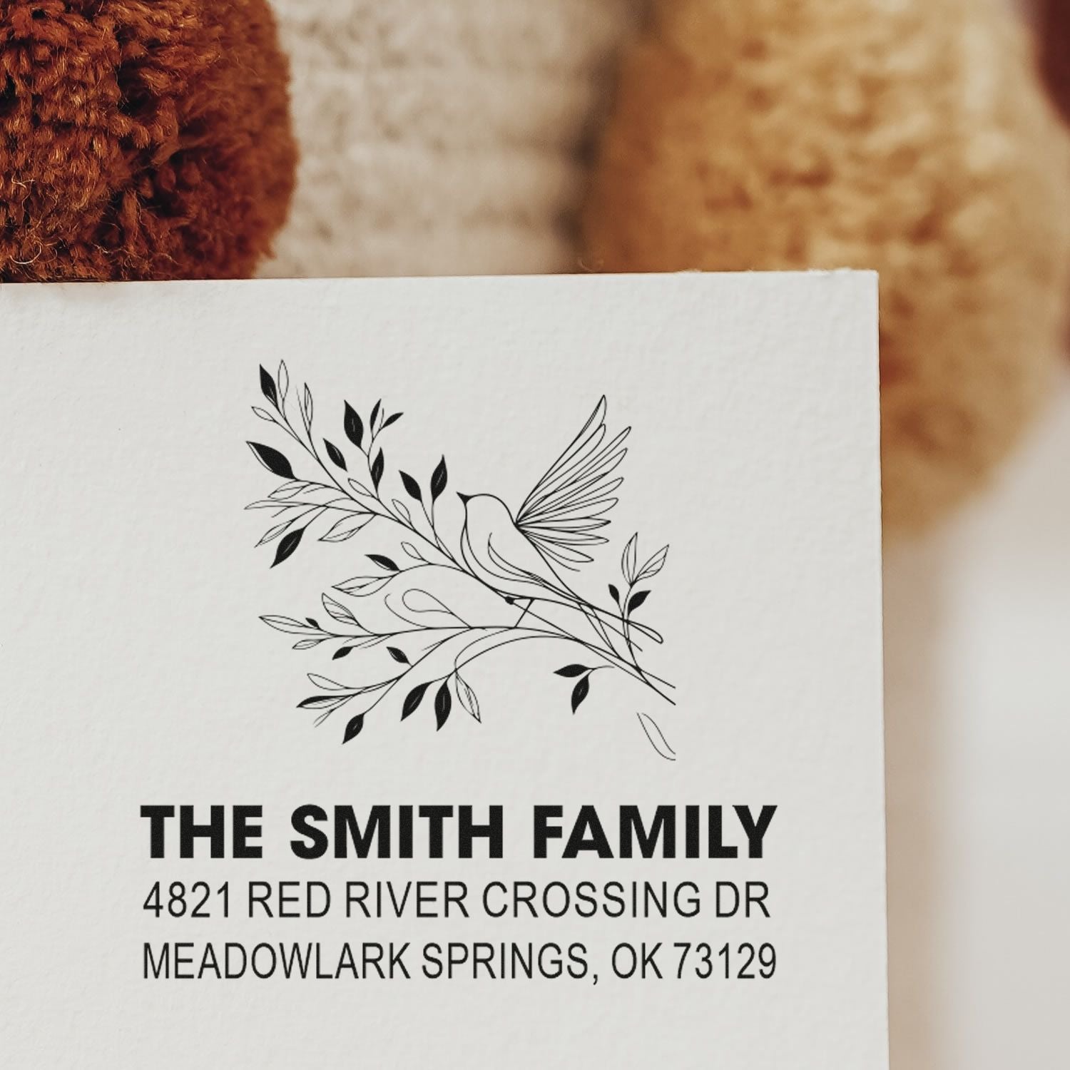 Custom family return address rubber stamp with bird and leafy branch design, featuring The Smith Family and Meadowlark Springs, OK address.