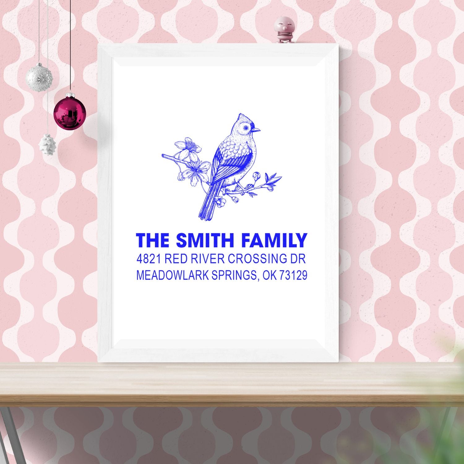 Custom return address rubber stamp with blue bird and floral design, personalized family name and address for wedding mail and stationery.