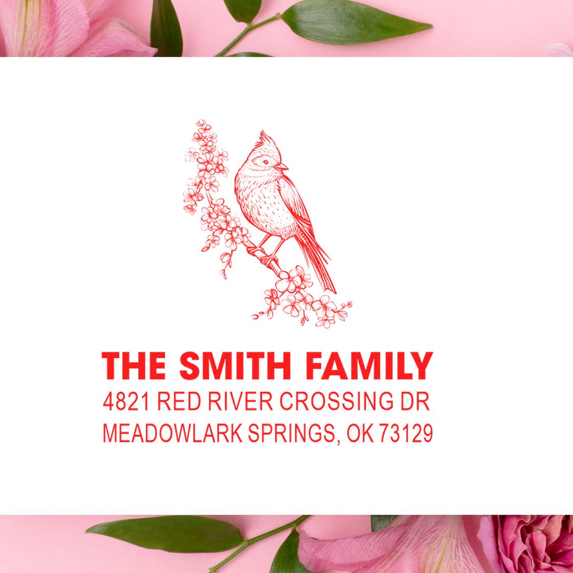 Personalized red rubber address stamp with bird and floral design, featuring The Smith Family and Meadowlark Springs, OK mailing address.