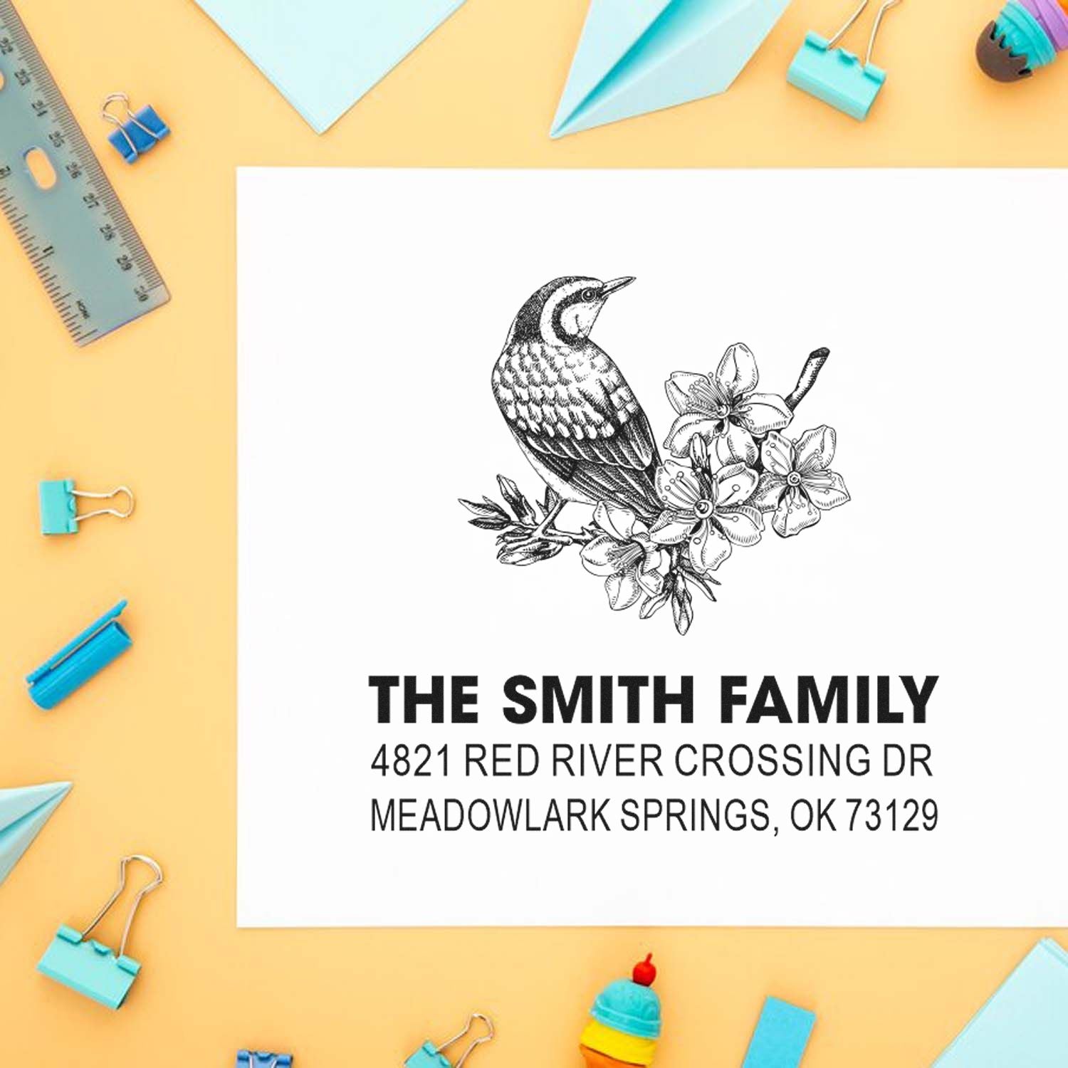 Custom address rubber stamp with bird and floral design for The Smith Family, featuring return address in Meadowlark Springs, OK 73129.