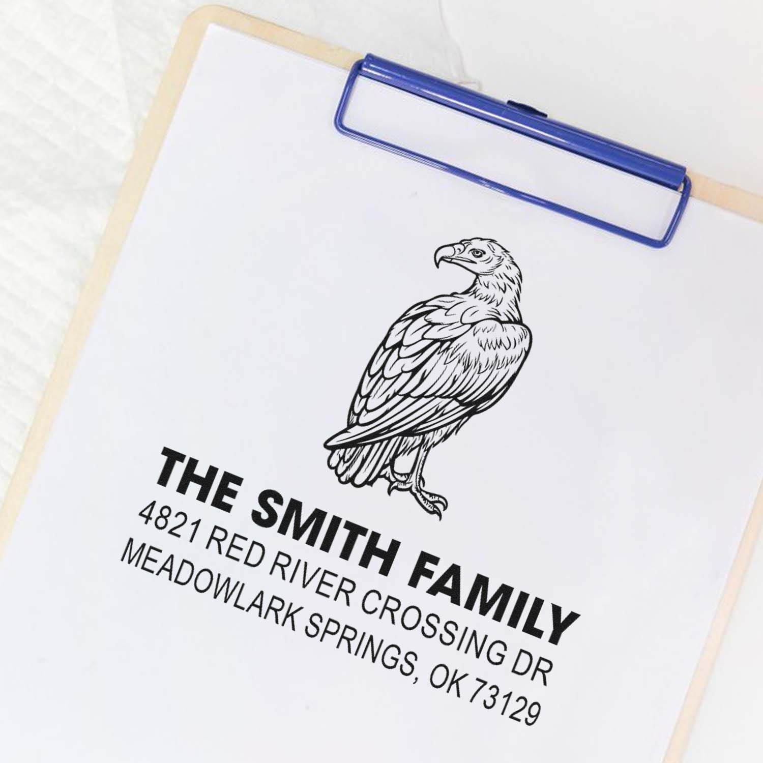 Custom rubber address stamp with eagle logo, featuring The Smith Family name and address for business or personal mailing use.