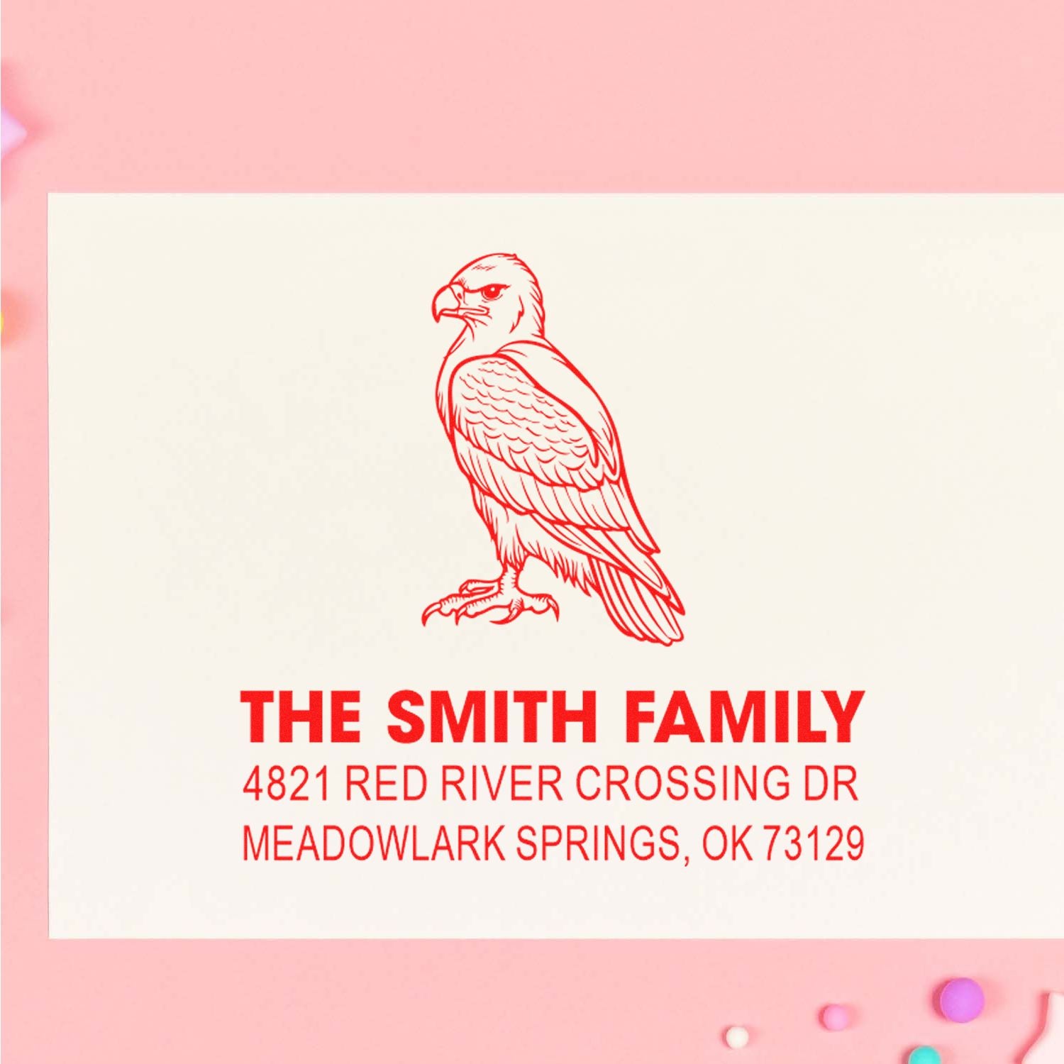 Custom rubber address stamp with red eagle design, The Smith Family name, and Meadowlark Springs, OK return address for personalized mailing envelopes