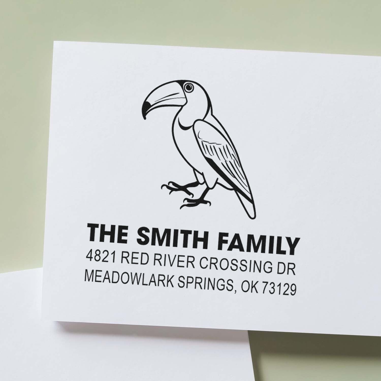 Custom return address rubber stamp with toucan design, The Smith Family, Meadowlark Springs OK 73129, for envelopes and stationery.