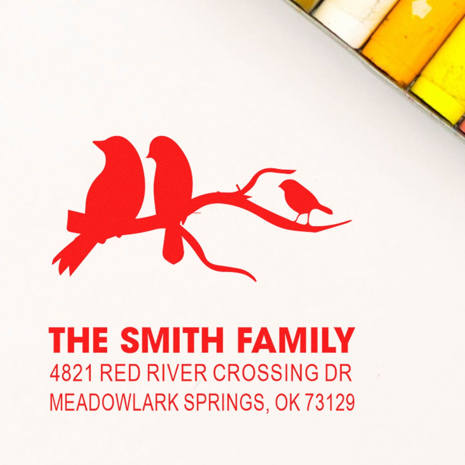 Custom rubber address stamp with birds on a branch, featuring The Smith Family name and Meadowlark Springs, OK return address in red ink for mail.