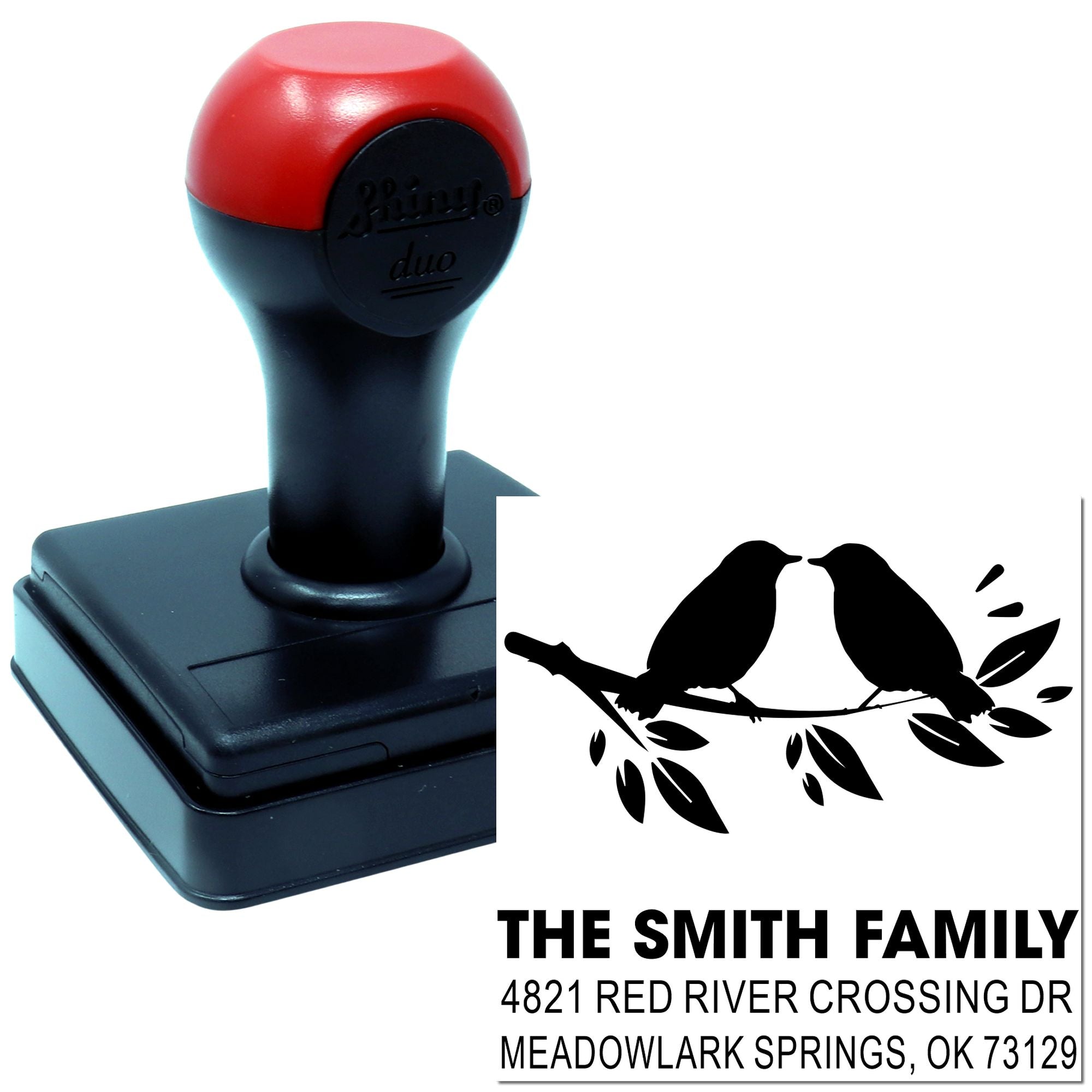 Custom self-inking rubber stamp with red and black handle, bird motif, and personalized family return address for envelopes, mail, and correspondence