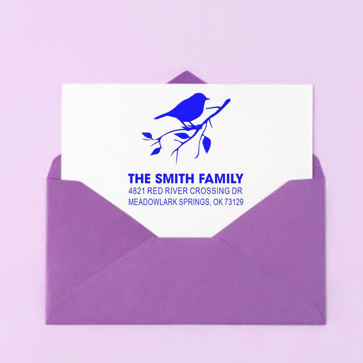 Custom return address rubber stamp for The Smith Family with bird logo and Meadowlark Springs, OK mailing details for envelopes