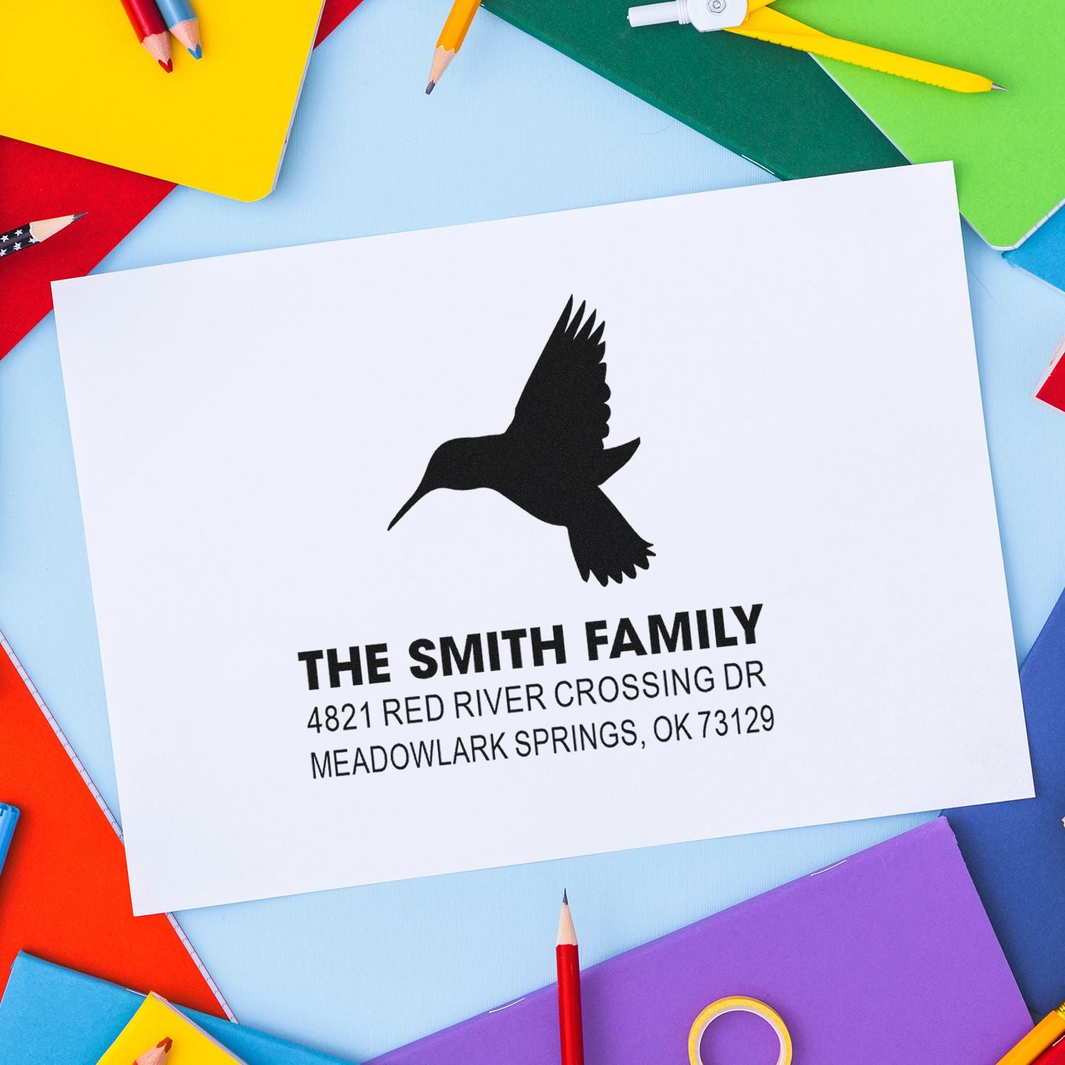 Custom hummingbird return address rubber stamp with family name and mailing address, perfect for envelopes, stationery, and wedding invitations.