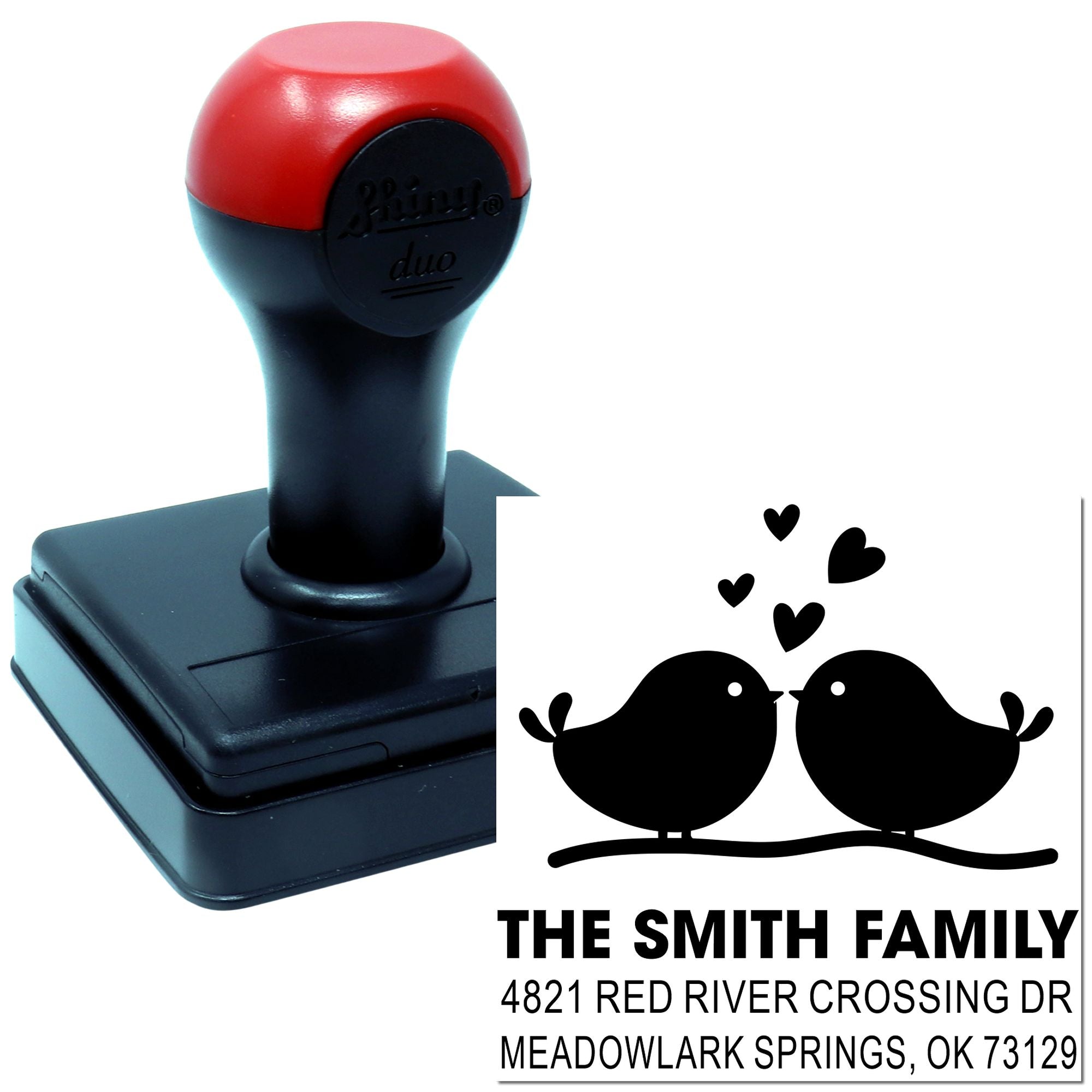 Custom self-inking rubber address stamp with two birds and hearts, personalized family name and return address for wedding invitations or home use.