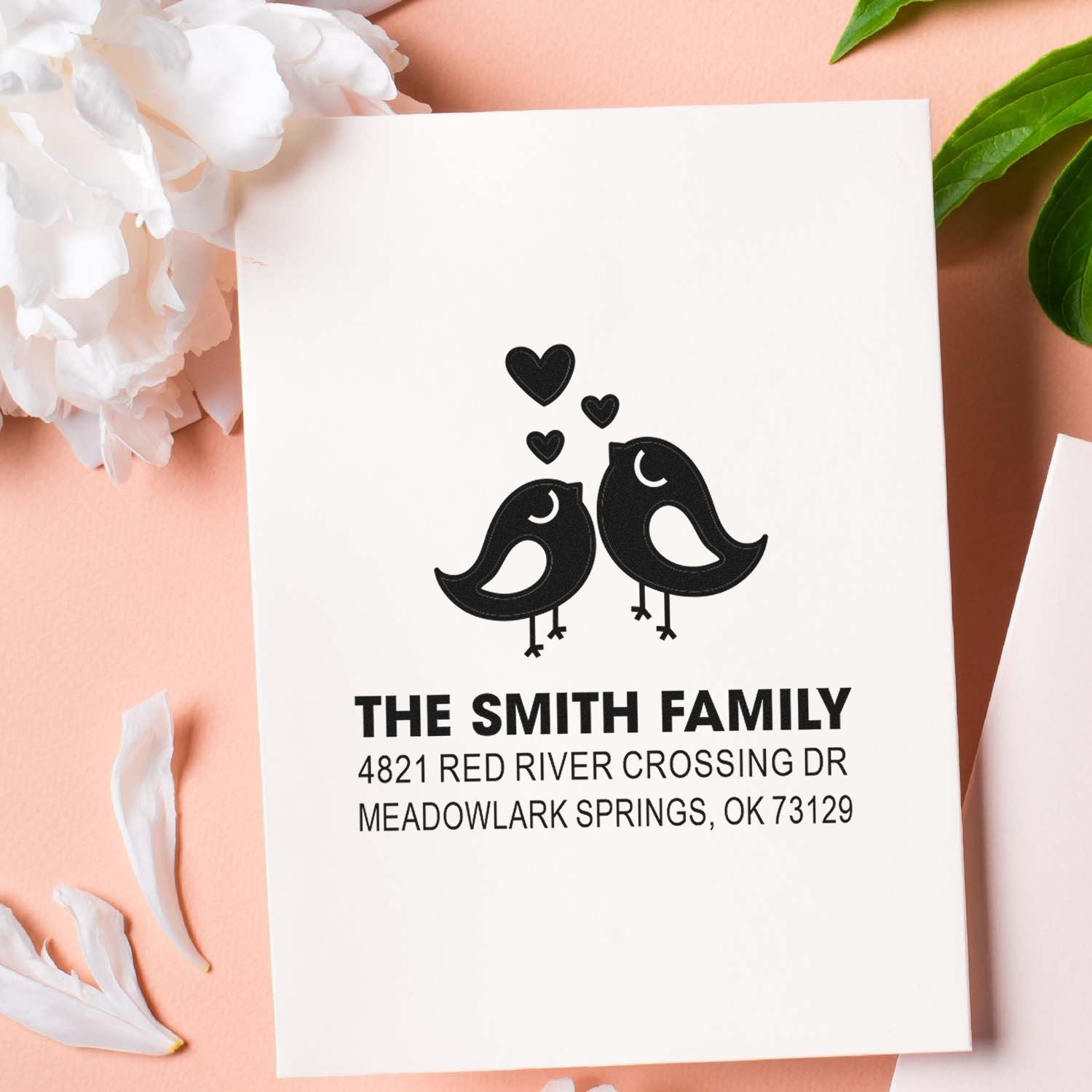 Custom self-inking return address stamp with two birds and hearts, personalized for The Smith Family at Meadowlark Springs, OK 73129.