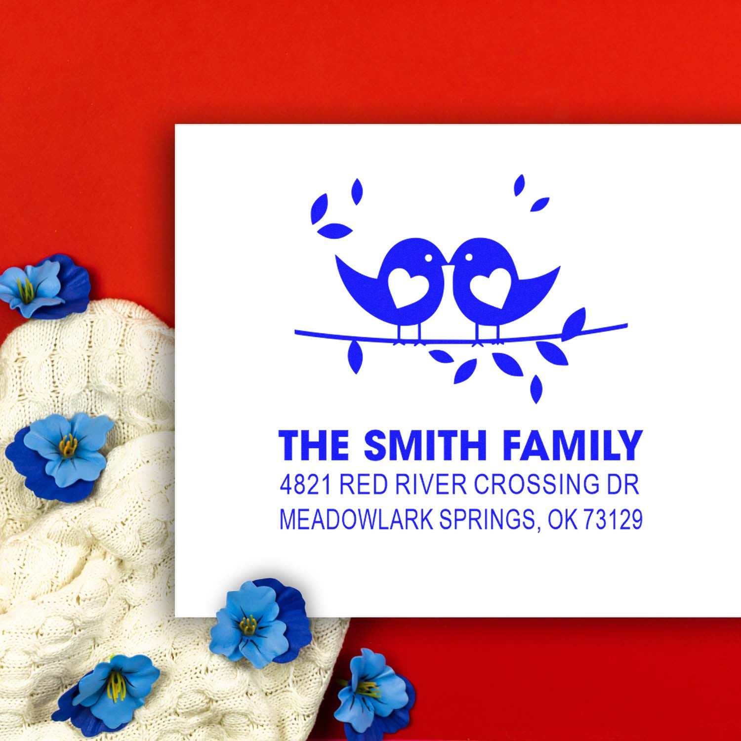 Custom return address rubber stamp with two blue birds on a branch, personalized family name and mailing address for stationery and envelopes.