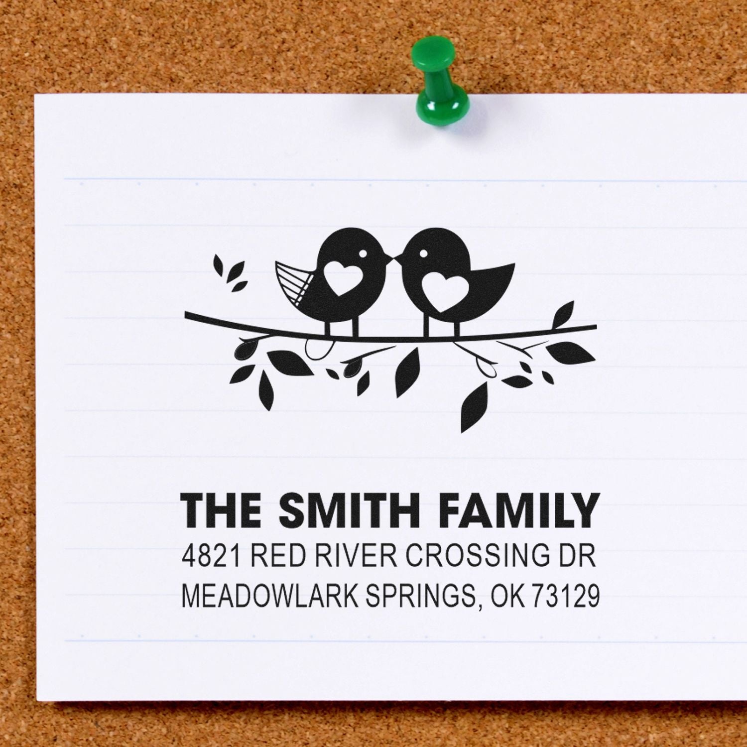 Custom return address rubber stamp with two birds on a branch, personalized family name, street address, city, state, and ZIP for mailing labels.