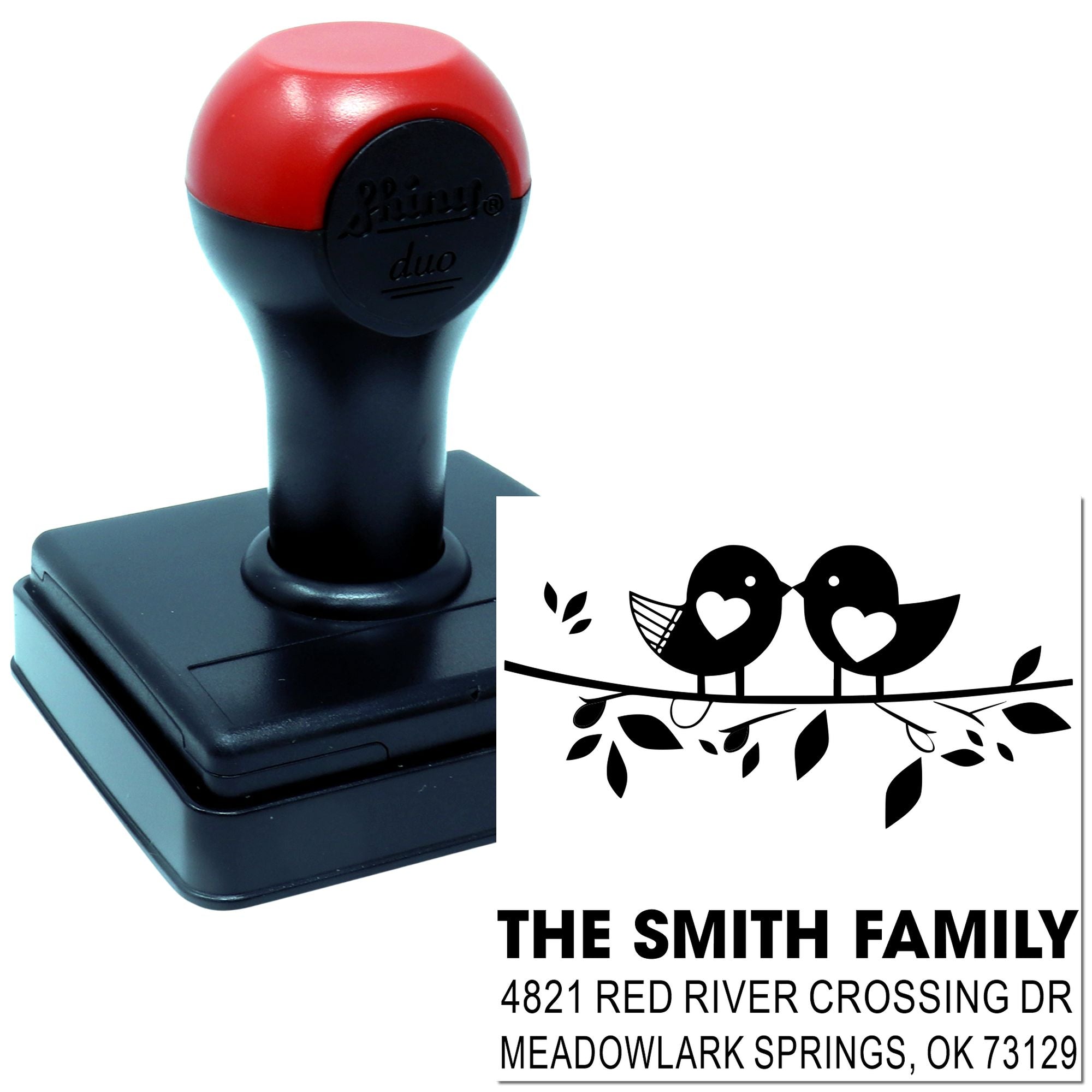 Custom self-inking address rubber stamp with red and black handle, featuring bird design, family name, and return address for mailing envelopes.