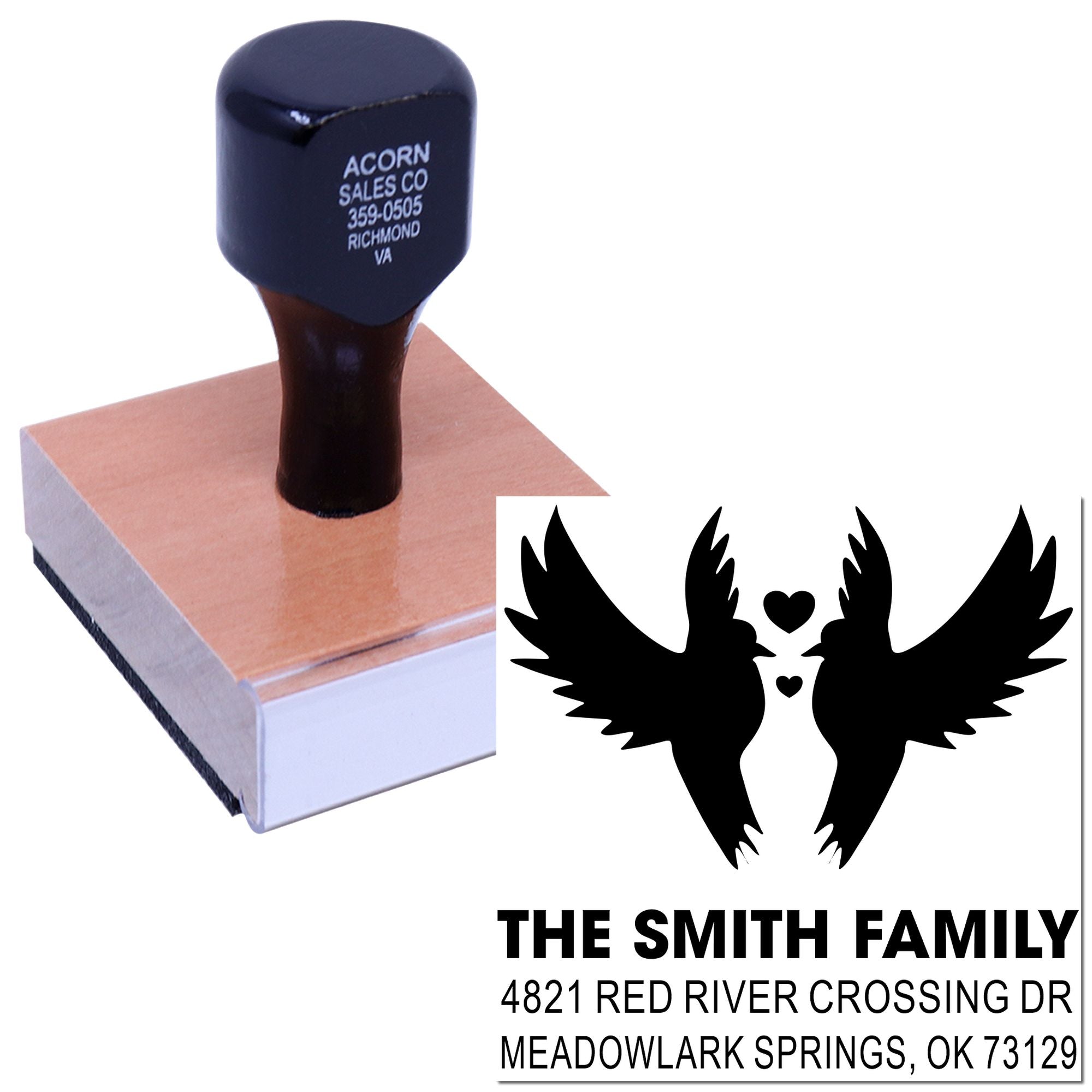 Custom return address rubber stamp with winged heart family design, black handle and wooden base for personalized mailing and envelope use.