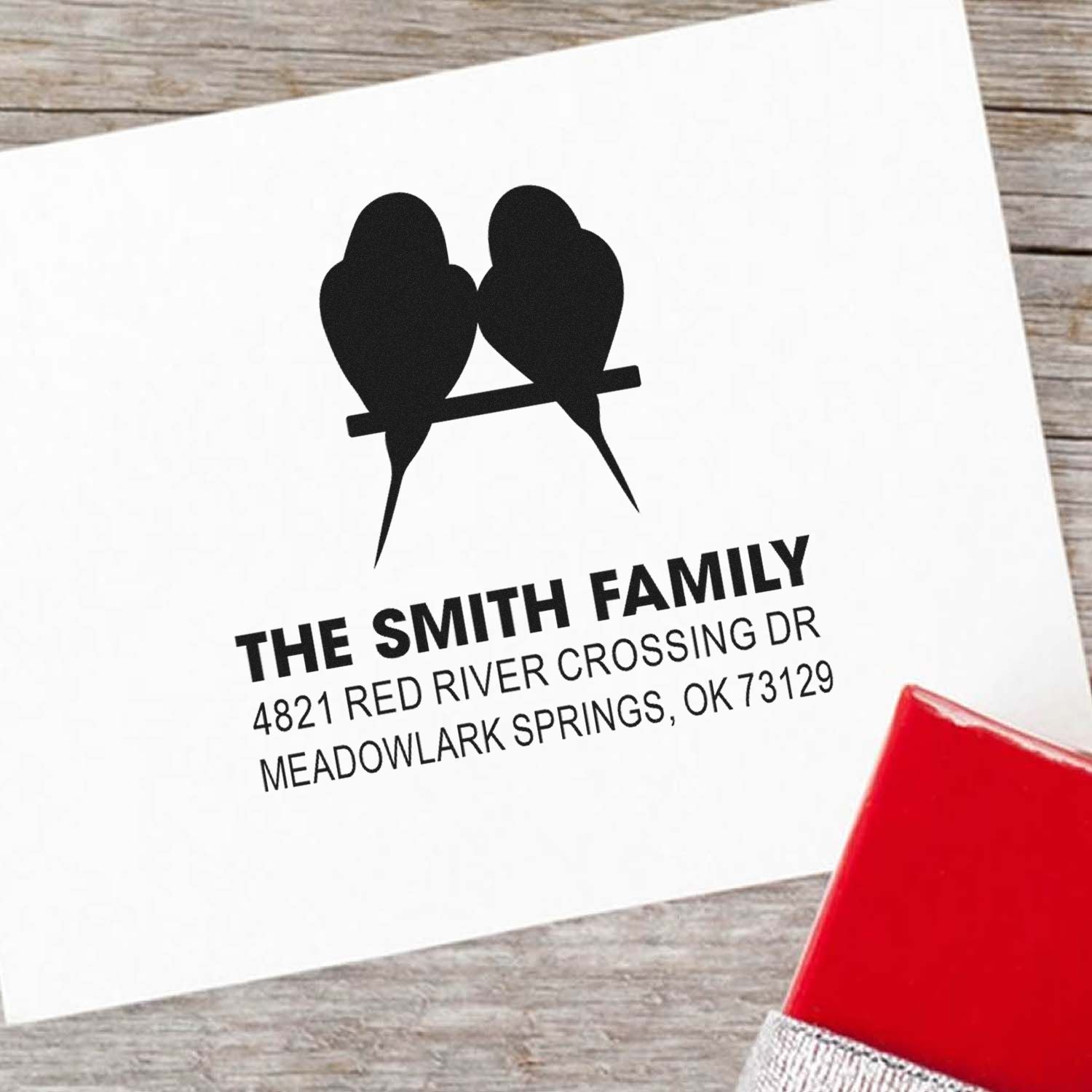 Custom return address rubber stamp with two birds on a branch, personalized family name design and bold address imprint for envelopes and stationery