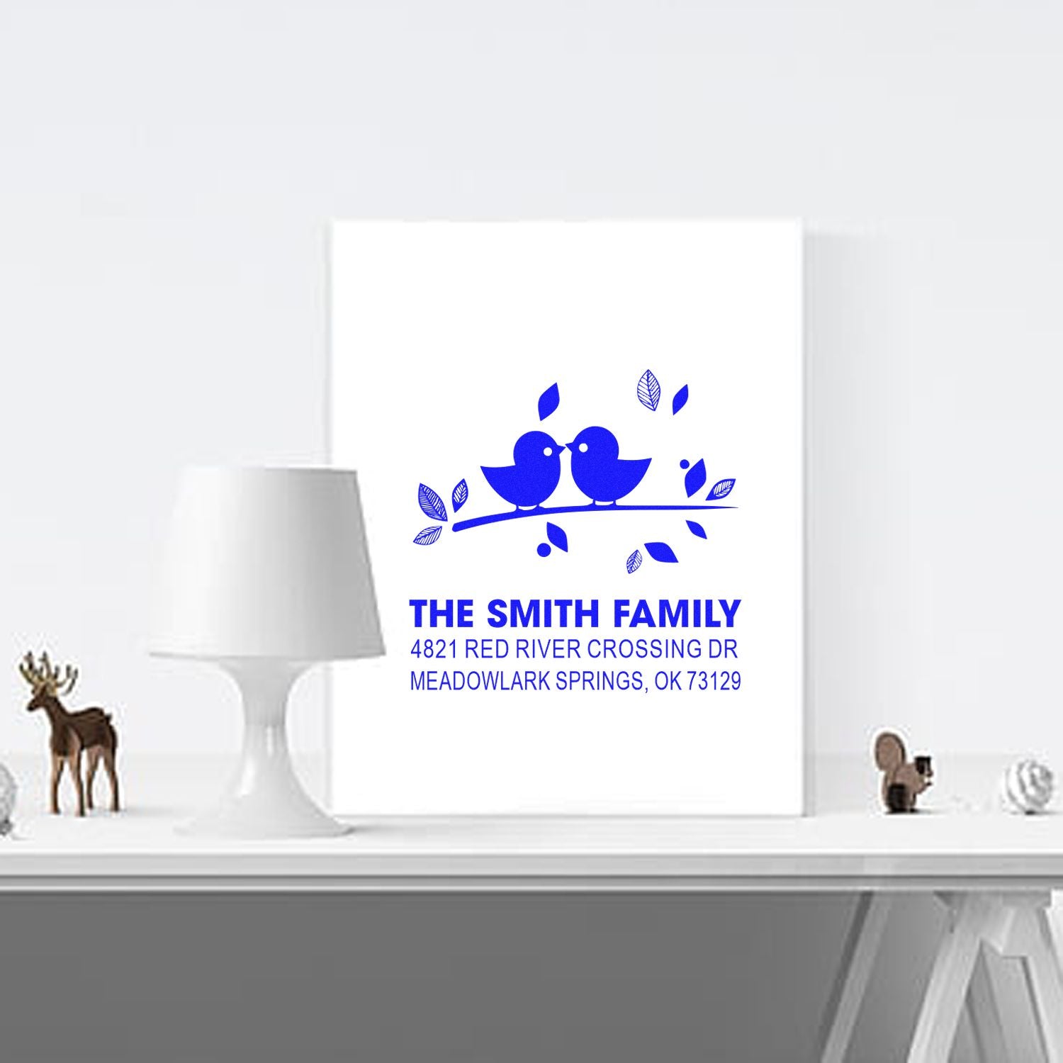 Personalized self-inking address stamp with blue bird design for The Smith Family, featuring custom name and Meadowlark Springs, OK address.